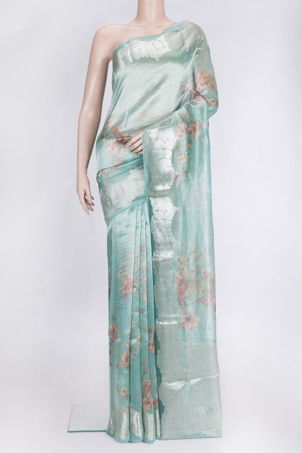 Sky Blue Dual Tone Organza Silk Saree with Printed design on the body and Zari Border.  displayed on a mannequin