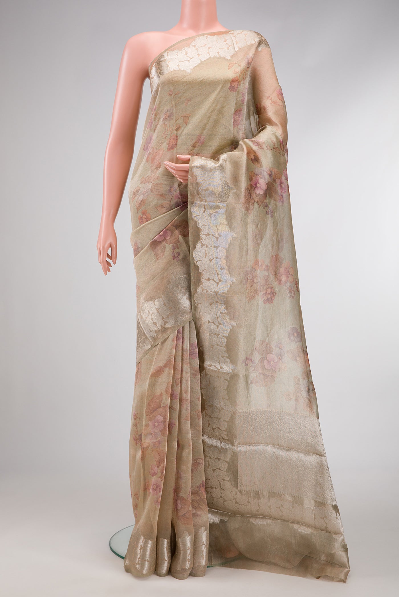 Pista Green Dual Tone Organza Silk Saree with Printed design on the body and Fancy Border.  displayed on a mannequin