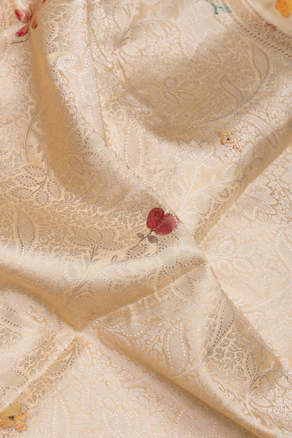 Close up of Sandal Tussar Silk Saree with Zari Brocade on the body and Fancy Border.  displaying folds