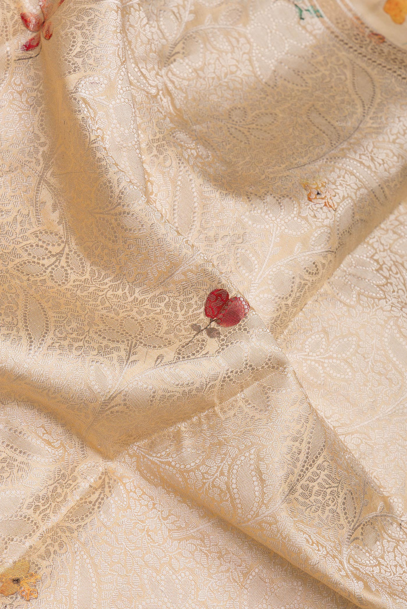 Close up of Sandal Tussar Silk Saree with Zari Brocade on the body and Fancy Border.  displaying folds