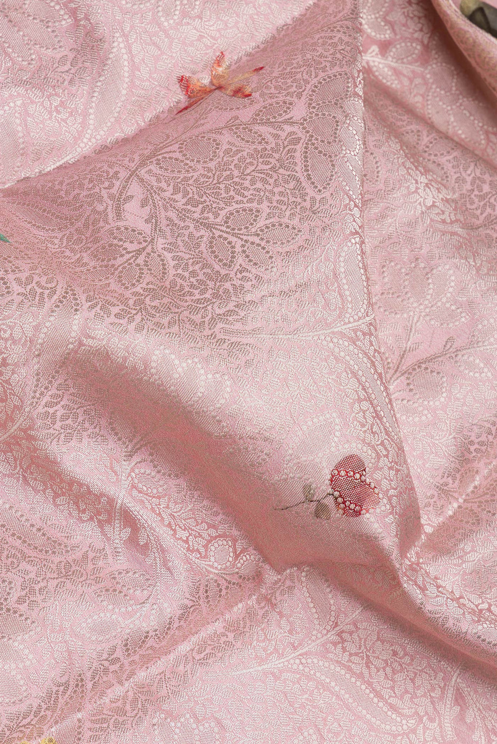 Close up of Pink Tussar Silk Saree with Zari Brocade on the body and Fancy Border.  displaying folds