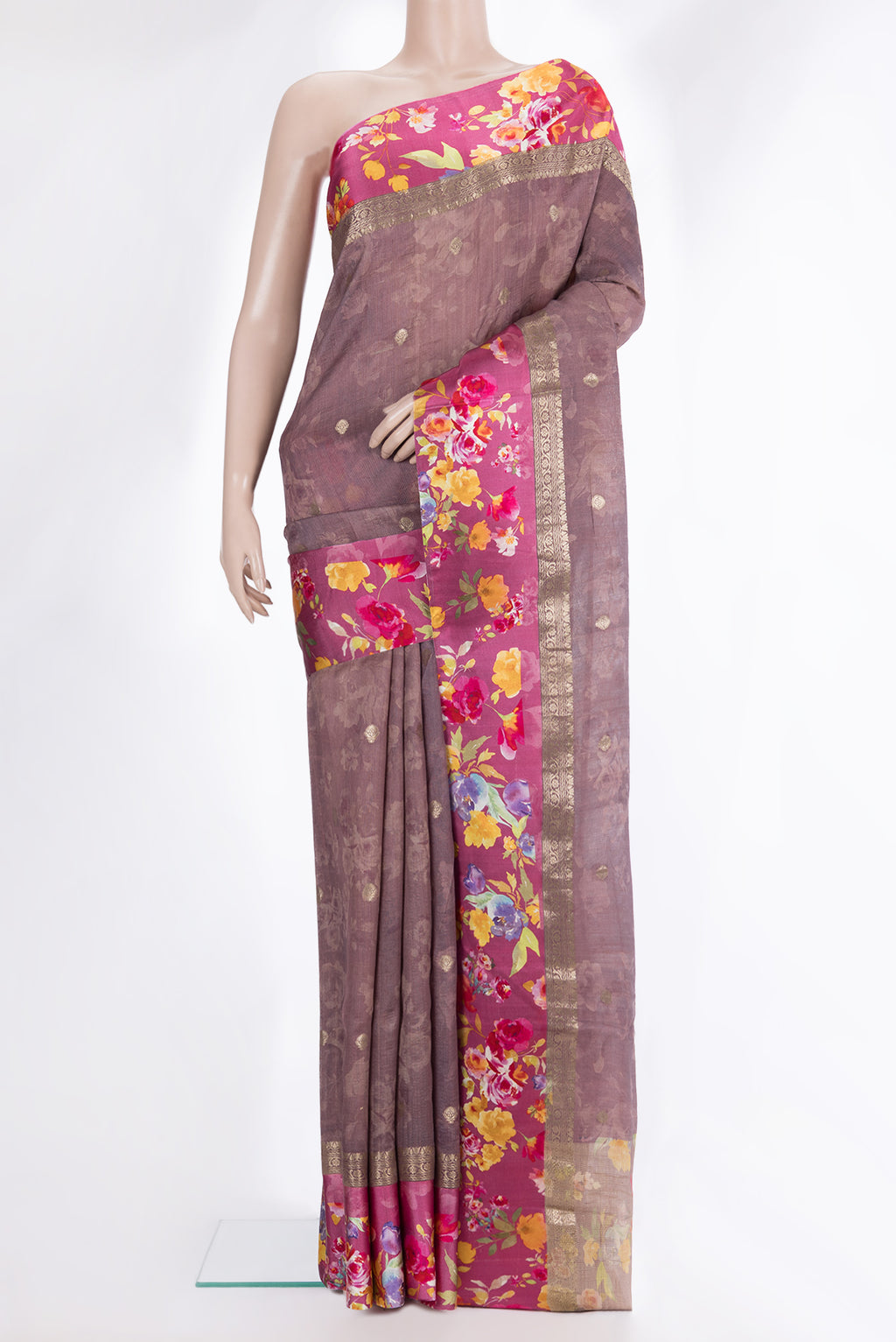 Pure Silk Mauve Tussar Saree with Zari Butta on the body and Fancy Border.  displayed on a mannequin