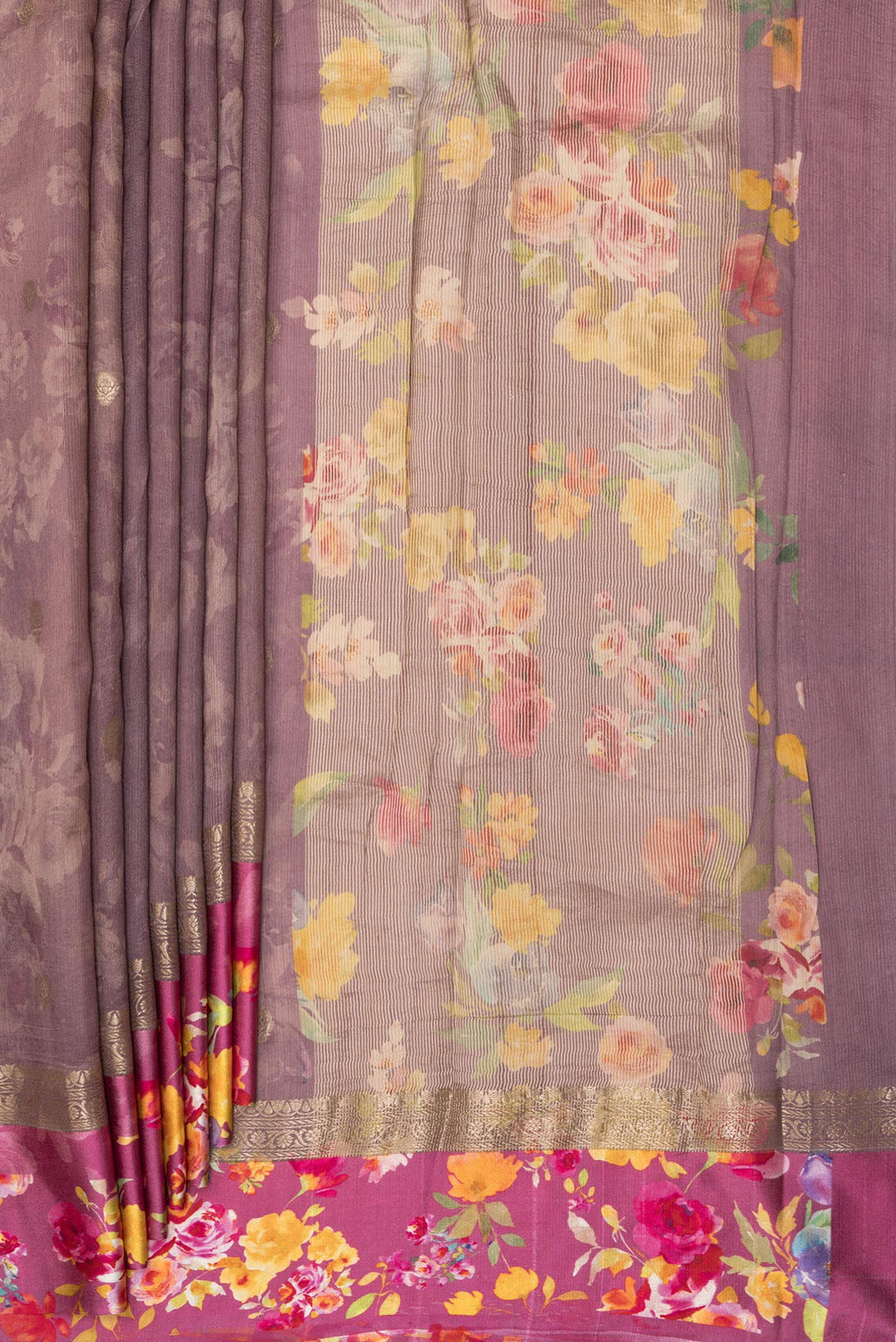 Pleats and pallu of Pure Silk Mauve Tussar Saree with Zari Butta on the body and Fancy Border. 