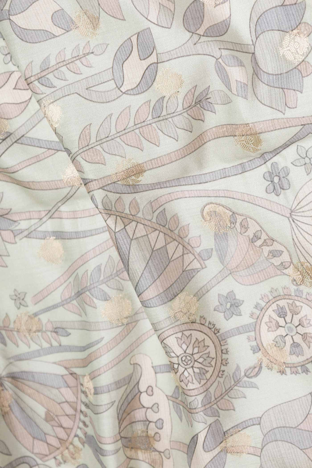 Close up of Light Green Dual Tone Tussar Silk Saree with Printed design on the body and Zari Border displaying folds