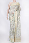Light Green Dual Tone Tussar Silk Saree with Printed design on the body and Zari Border displayed on a mannequin