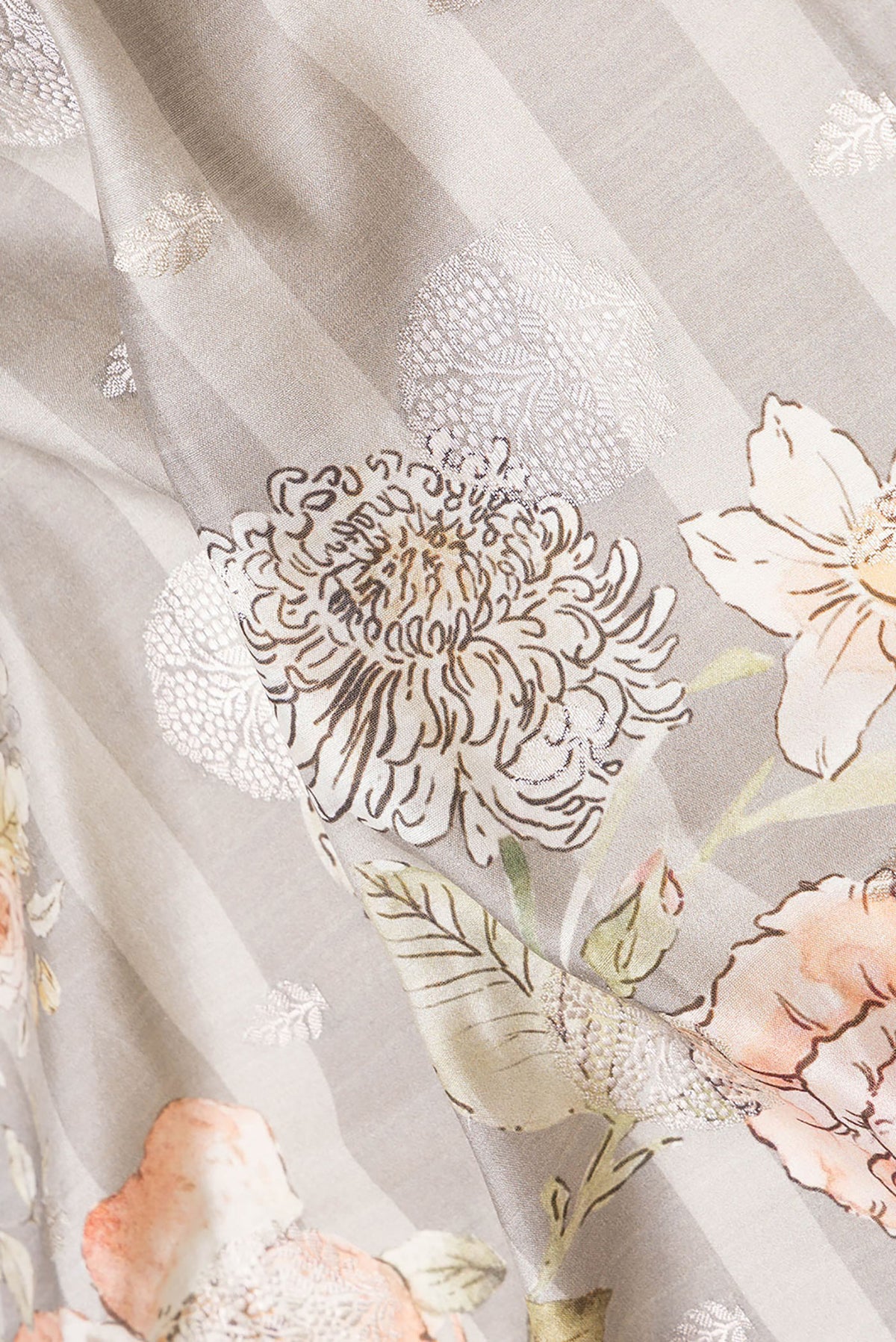 Close up of Grey Dual Tone Tussar Silk Saree with Printed design on the body and Zari Border.  displaying folds