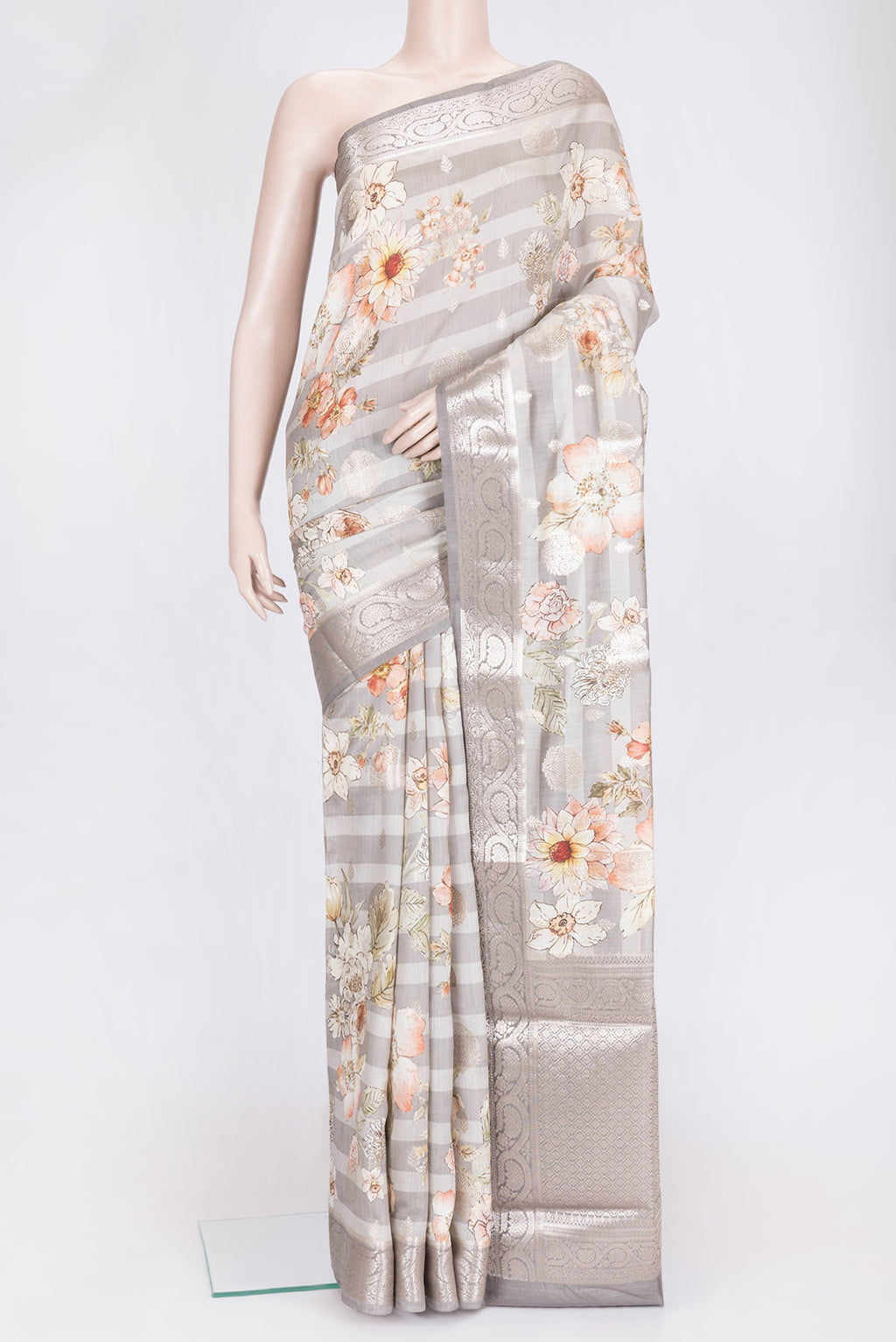Grey Dual Tone Tussar Silk Saree with Printed design on the body and Zari Border.  displayed on a mannequin