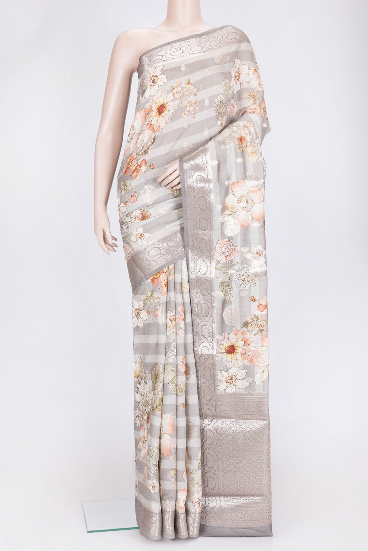 Grey Dual Tone Tussar Silk Saree with Printed design on the body and Zari Border.  displayed on a mannequin