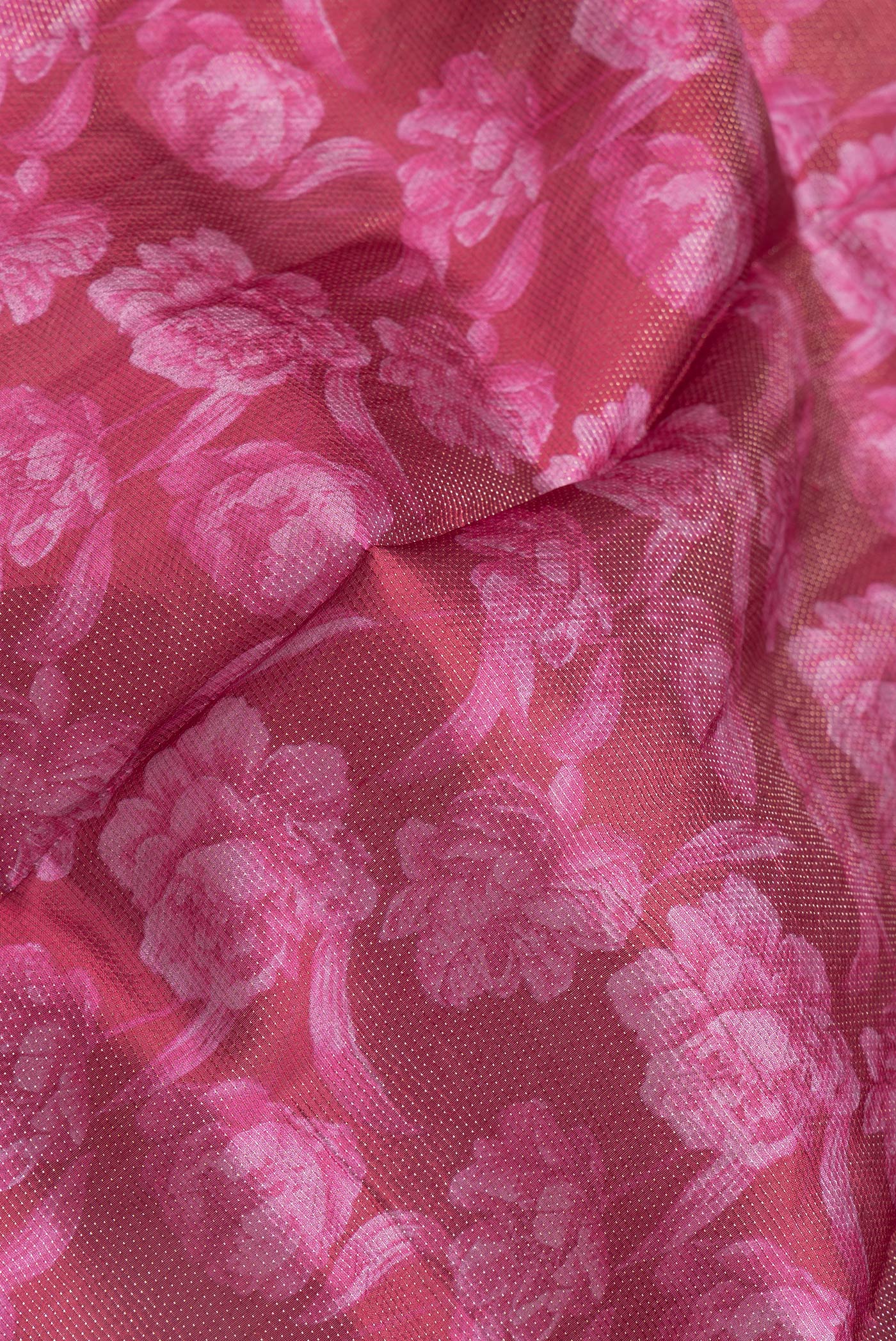 Close up of Maroon Dual Tone Tussar Silk Saree with Printed design on the body and Zari Border.  displaying folds