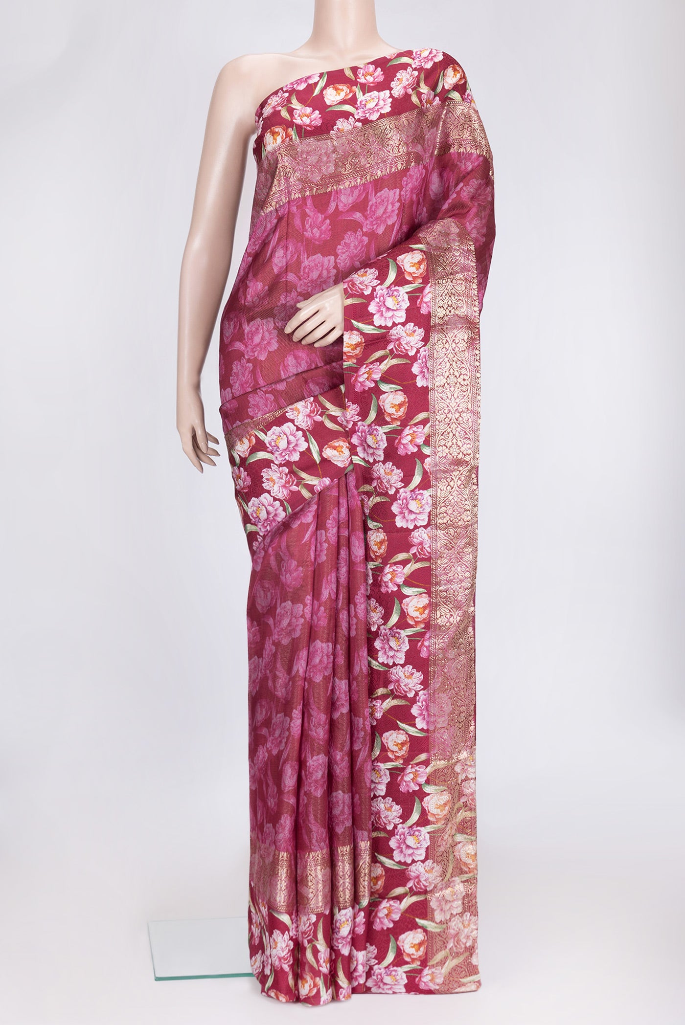 Maroon Dual Tone Tussar Silk Saree with Printed design on the body and Zari Border.  displayed on a mannequin