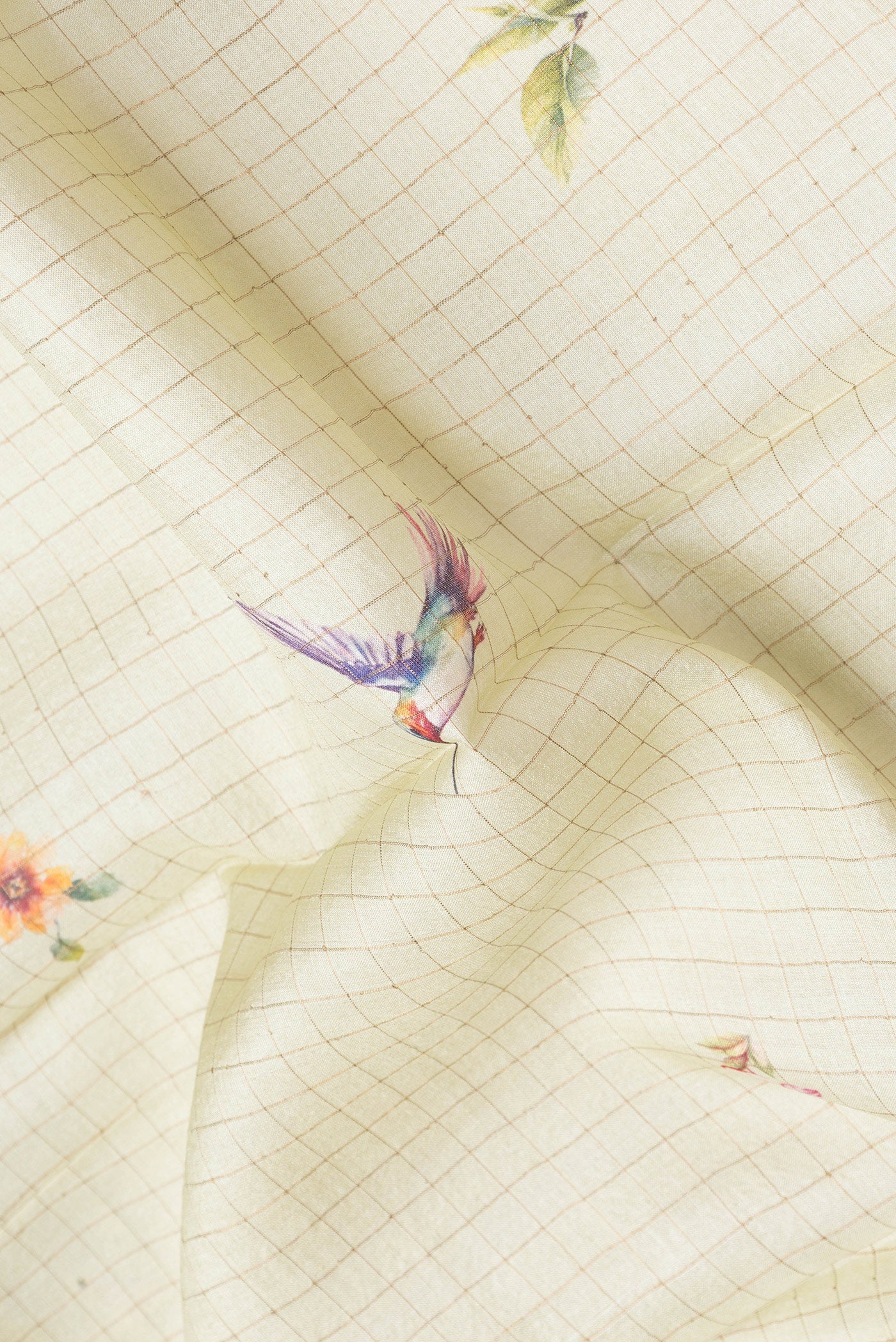 Close up of Beige Dual Tone Tussar Silk Saree with Checked design on the body and Fancy Border.  displaying folds