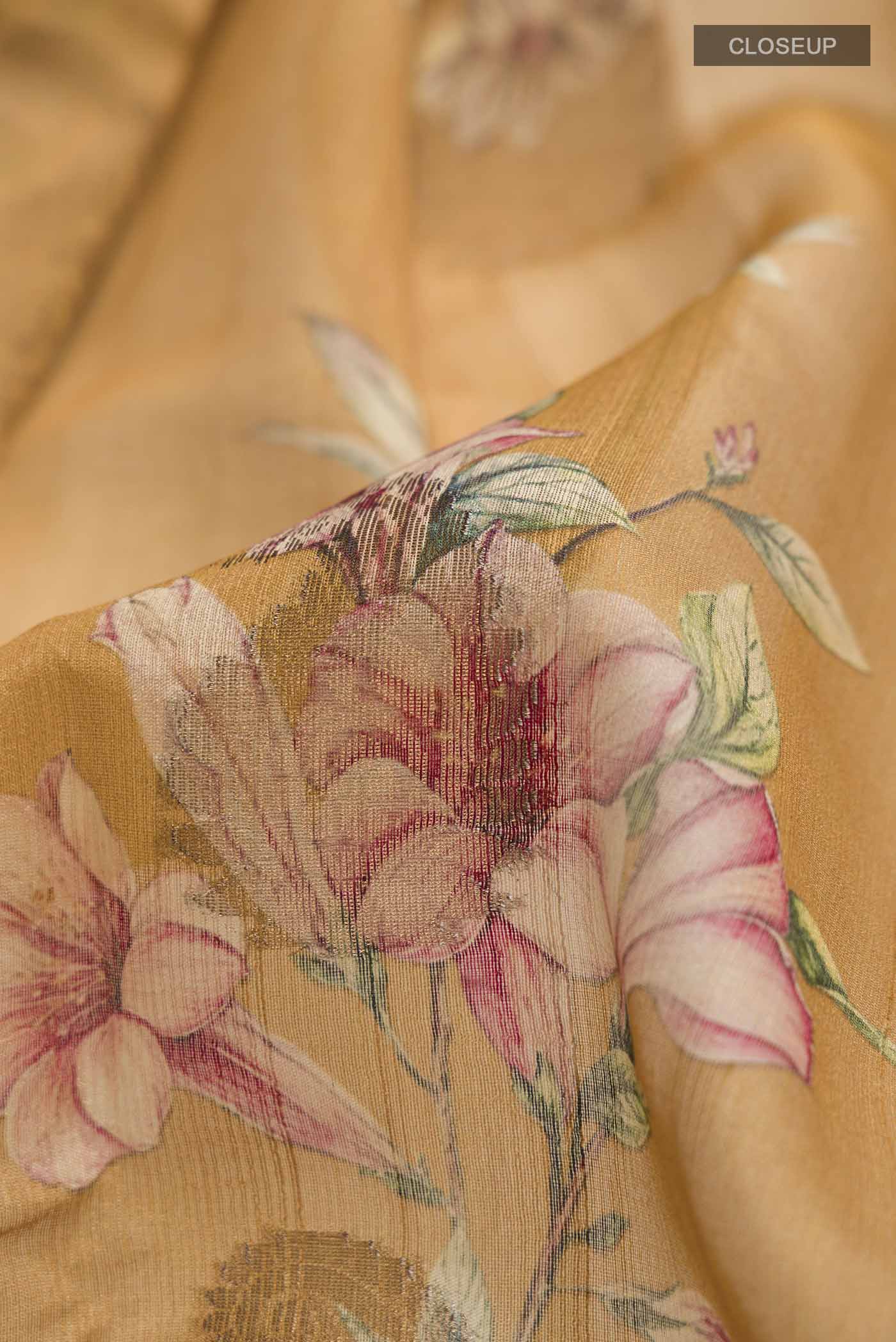 Close up of Yellow Bhagalpuri Tussar Silk Saree with Printed design on the body and Zari Border displaying folds
