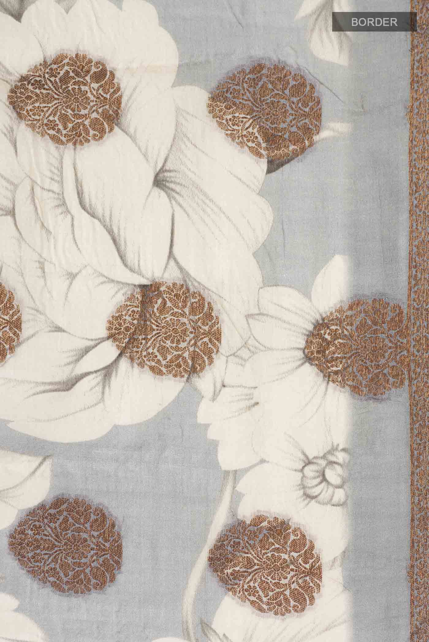 Border image of Grey Tussar Silk Saree with Zari Butta on the body and Zari Border