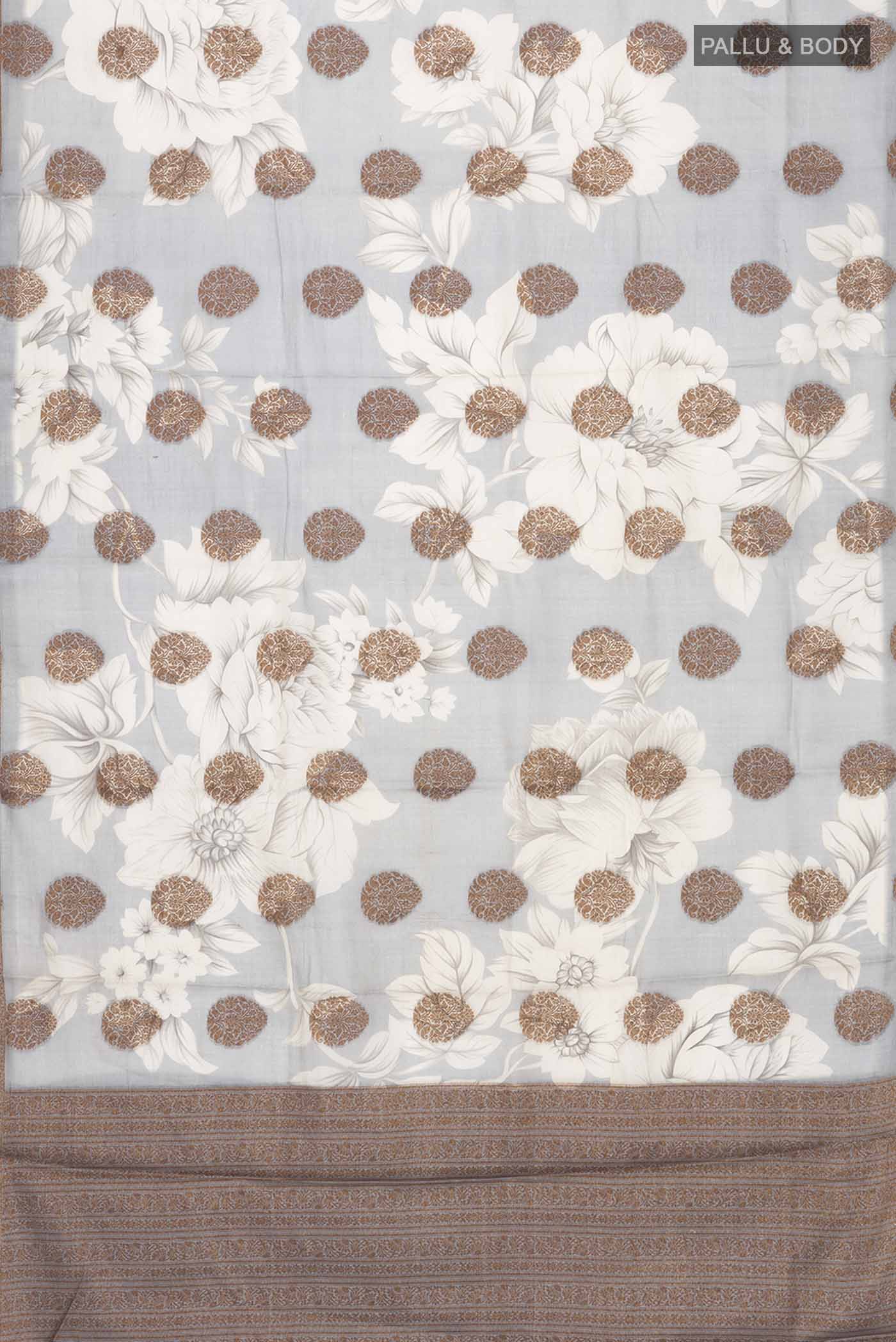 Flat view of Grey Tussar Silk Saree with Zari Butta on the body and Zari Border