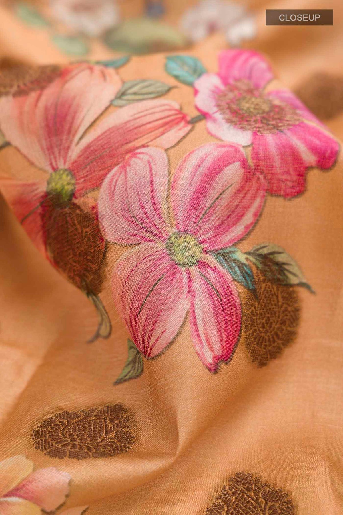 Close up of Mustard Tussar Silk Saree with Printed design on the body and Zari Border displaying folds