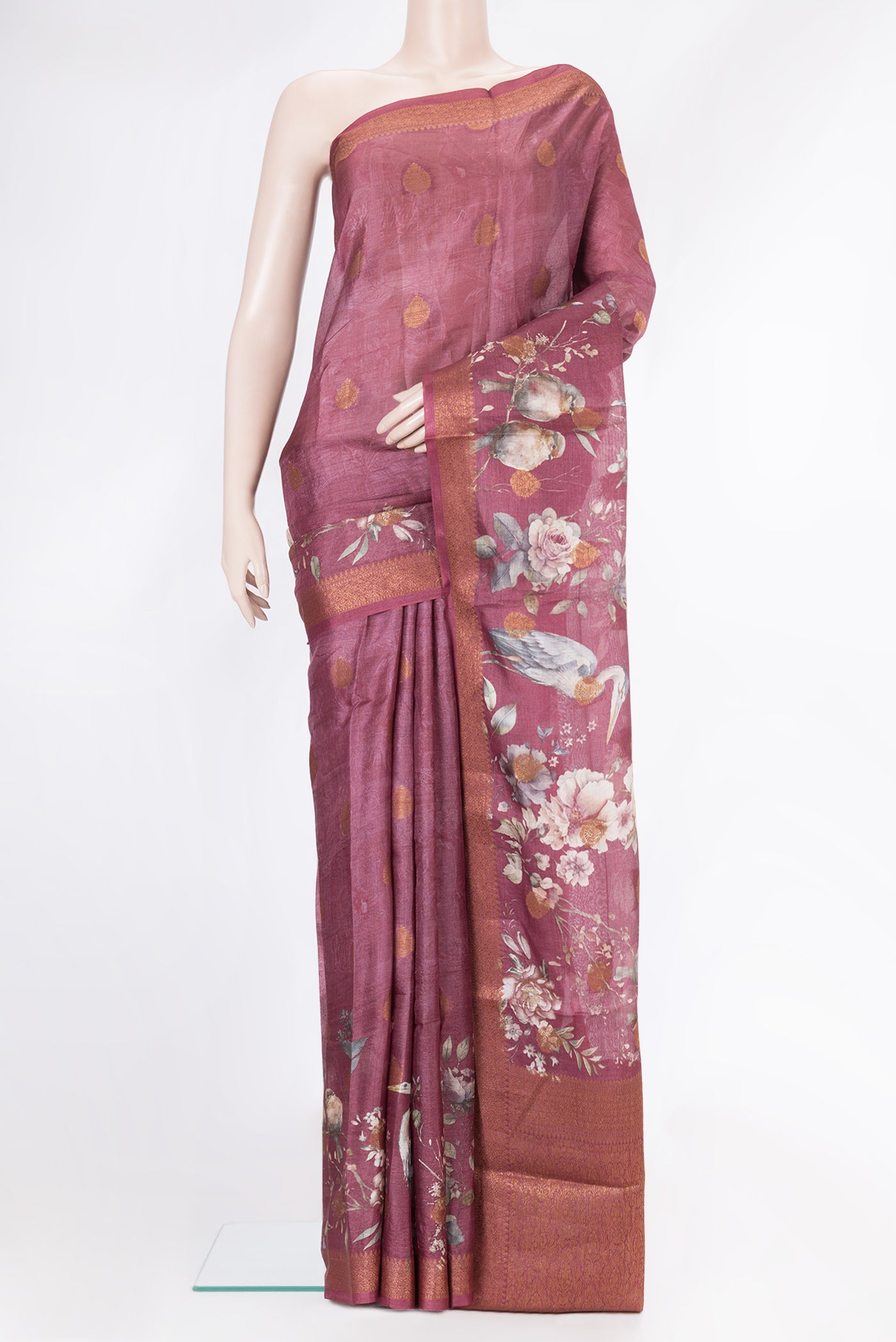 Mauve Dual Tone Tussar Silk Saree with Printed design on the body and Thread Border.  displayed on a mannequin