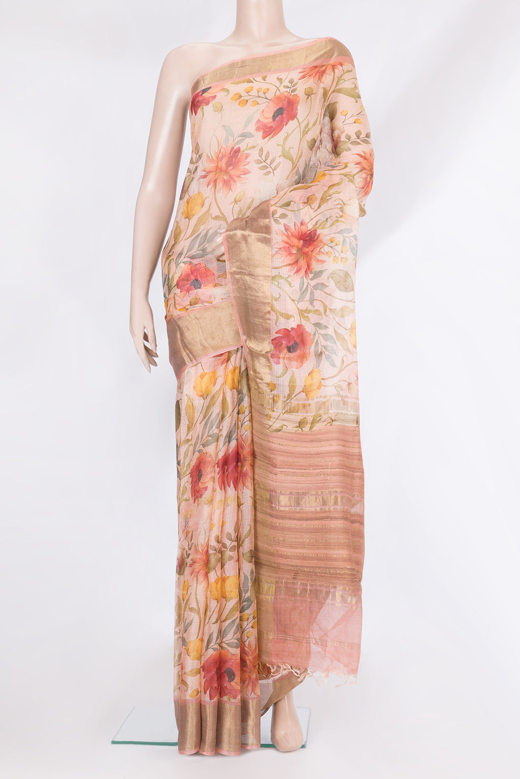 Rose Gold Kota Silk Saree with Floral Print on the body and Zari Border.  displayed on a mannequin