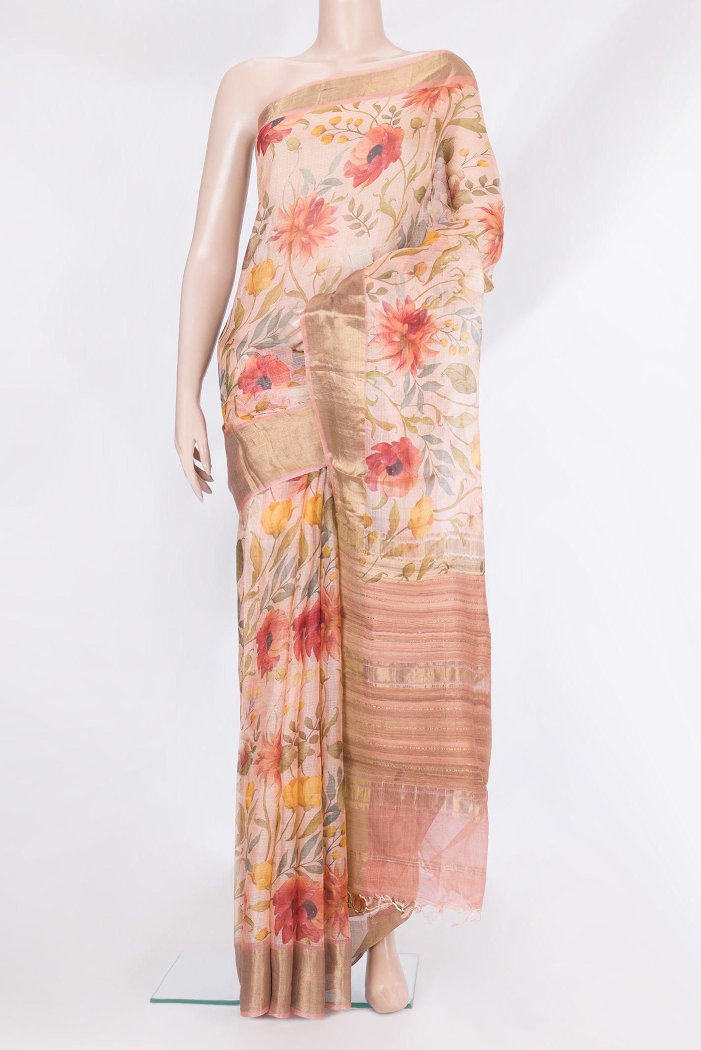Rose Gold Kota Silk Saree with Floral Print on the body and Zari Border.  displayed on a mannequin