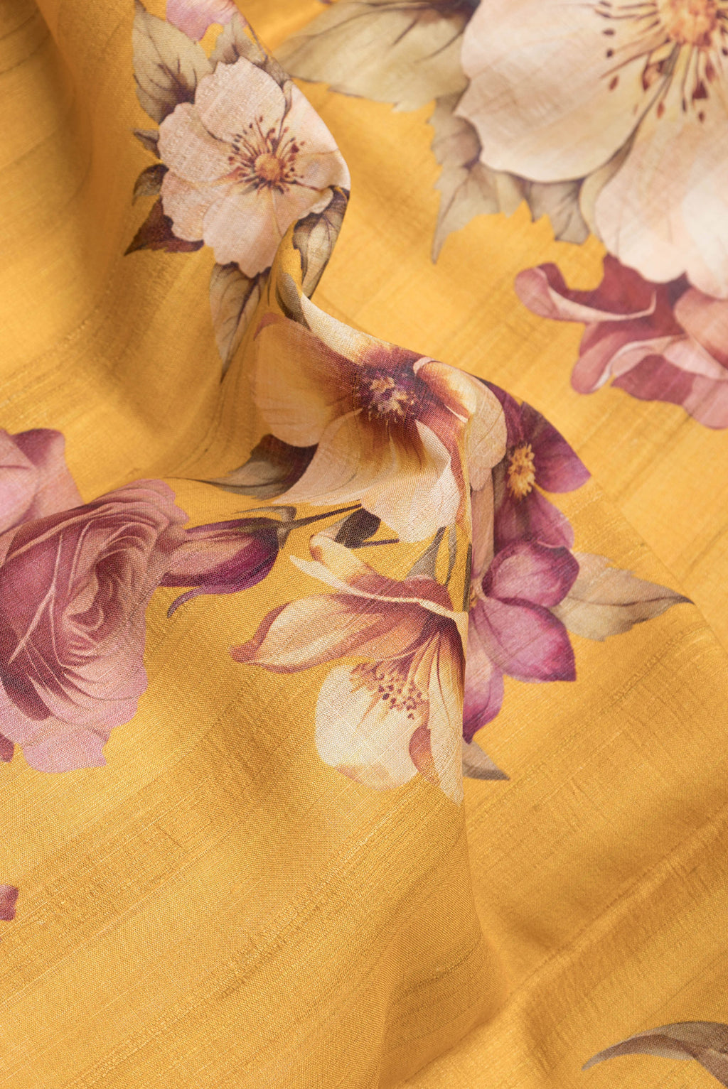 Close up of Yellow Dual Tone Tussar Silk Saree with Printed design on the body and Zari Border.  displaying folds