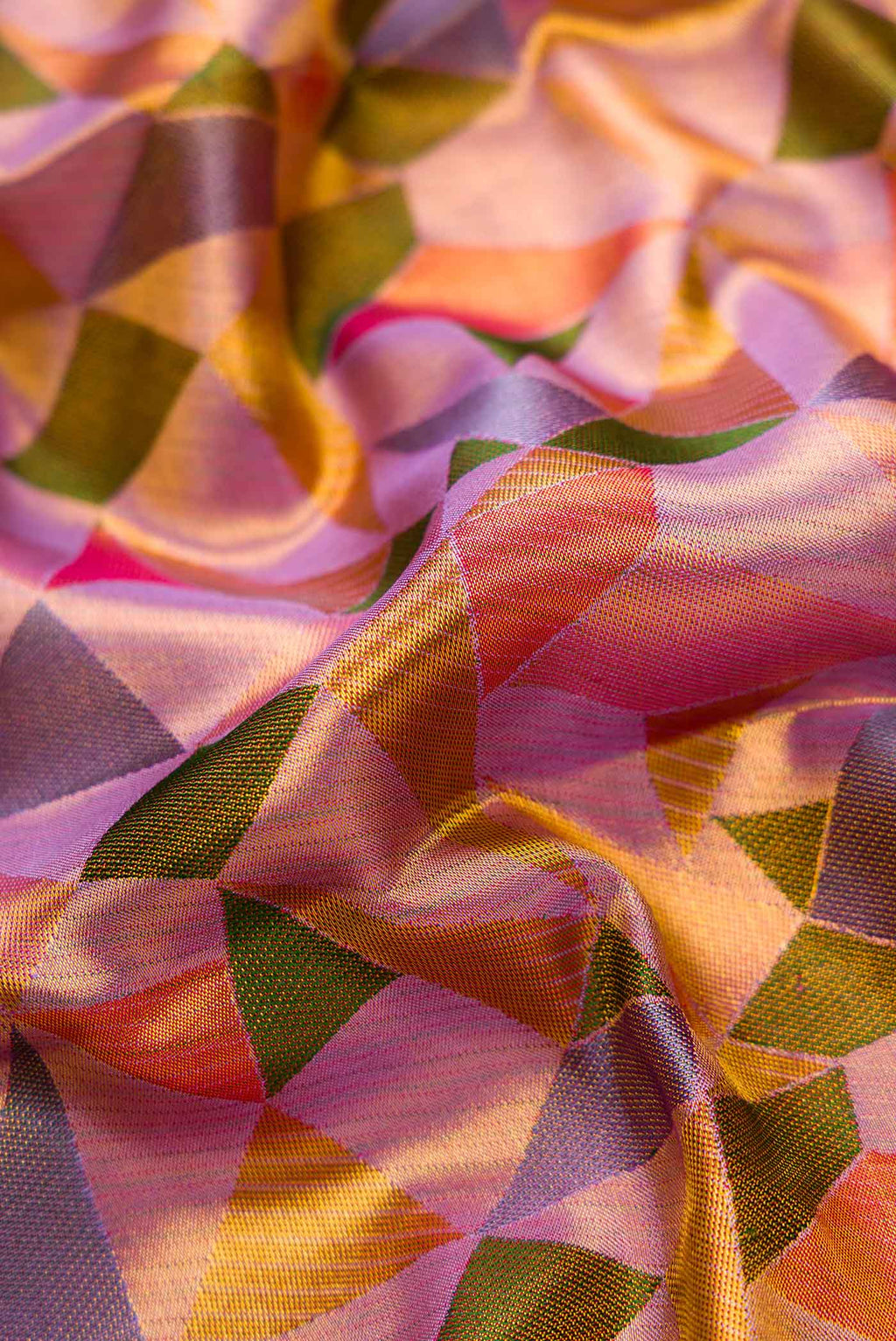 Close up of Lavender Dual Tone Kanjivaram Tissue Silk Saree with Zari Brocade on the body and Zari Border.  displaying folds