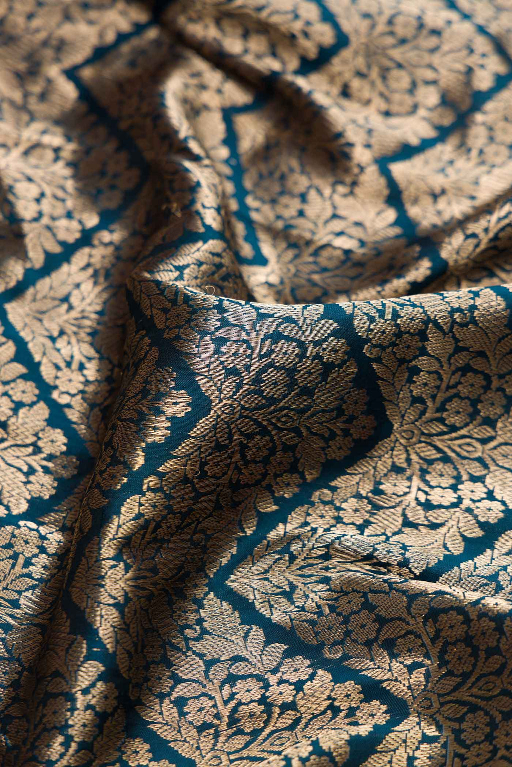 Close up of Maya Blue Dual Tone Banarasi Silk Saree with Zari Brocade on the body and Zari Border displaying folds