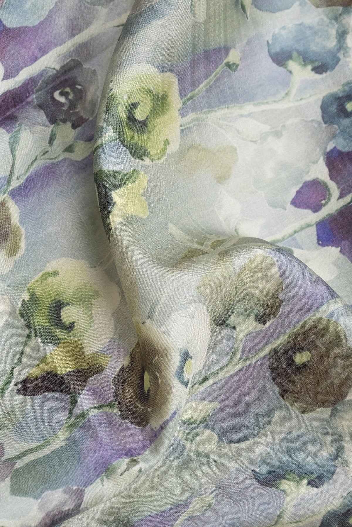 Close up of Light Green Dual Tone Tussar Silk Saree with Printed design on the body and Zari Border.  displaying folds