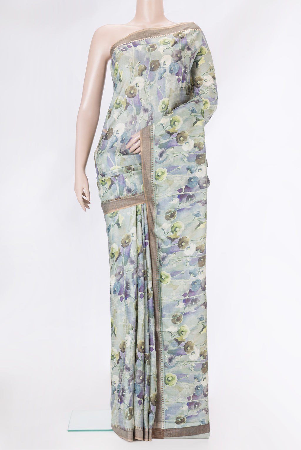 Light Green Dual Tone Tussar Silk Saree with Printed design on the body and Zari Border.  displayed on a mannequin