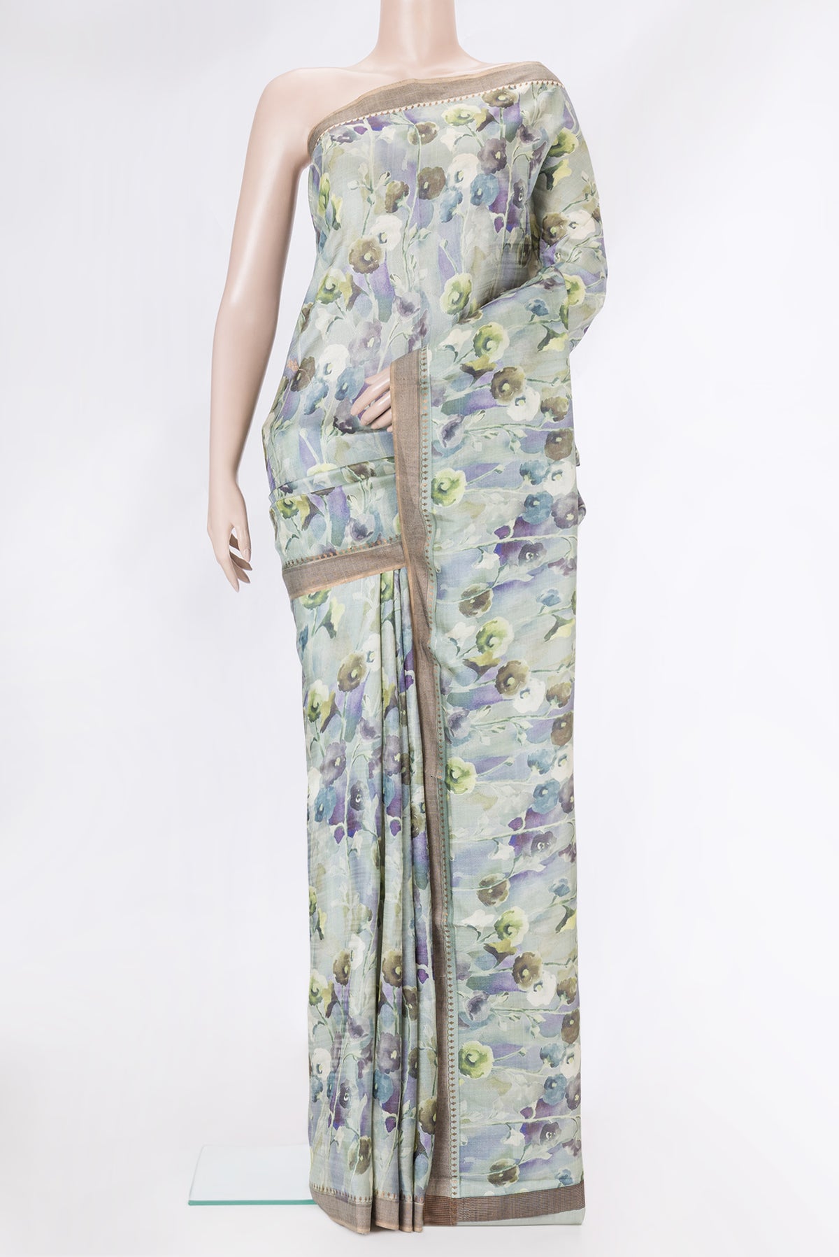 Light Green Dual Tone Tussar Silk Saree with Printed design on the body and Zari Border.  displayed on a mannequin