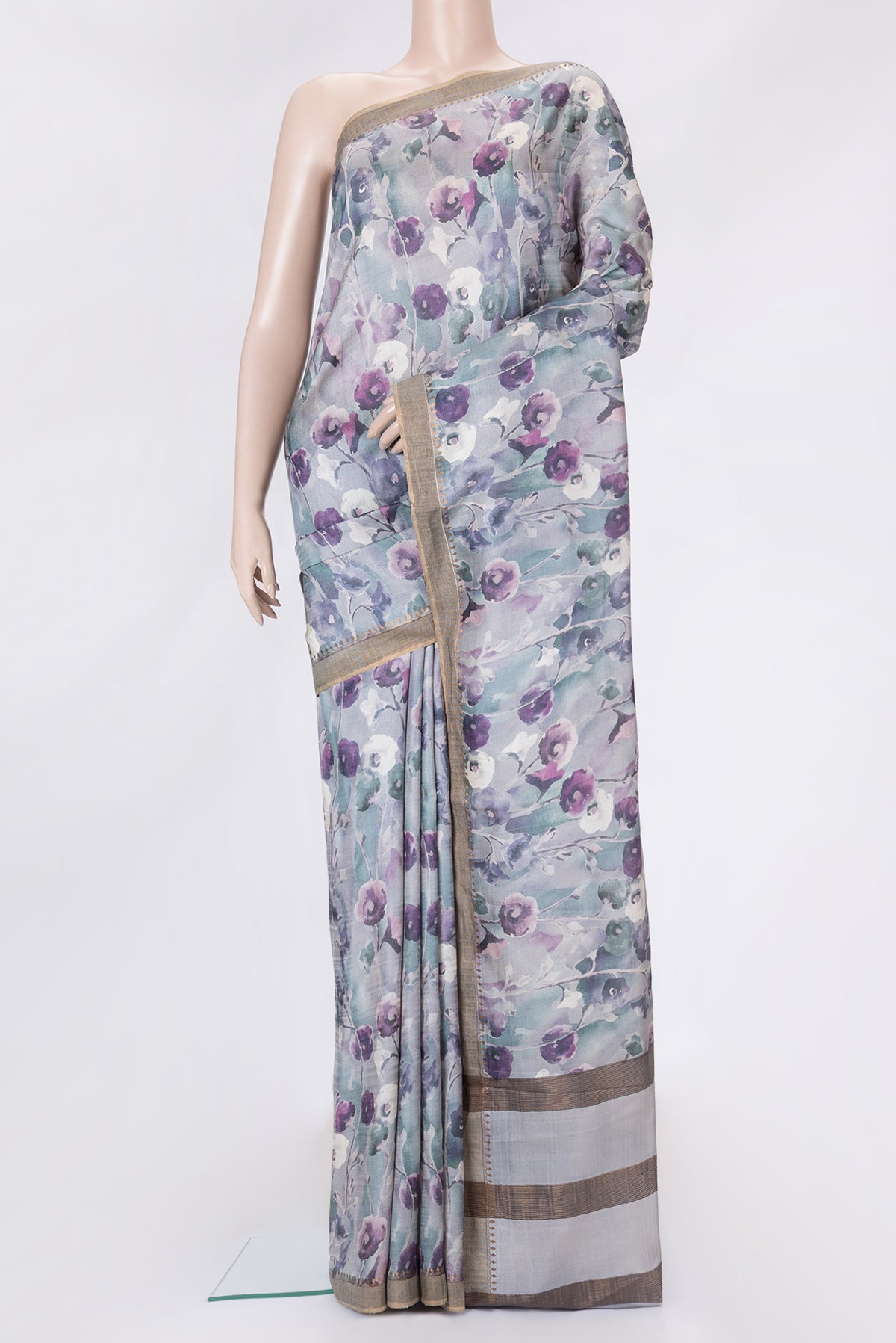 Grey Dual Tone Tussar Silk Saree with Printed design on the body and Zari Border.  displayed on a mannequin