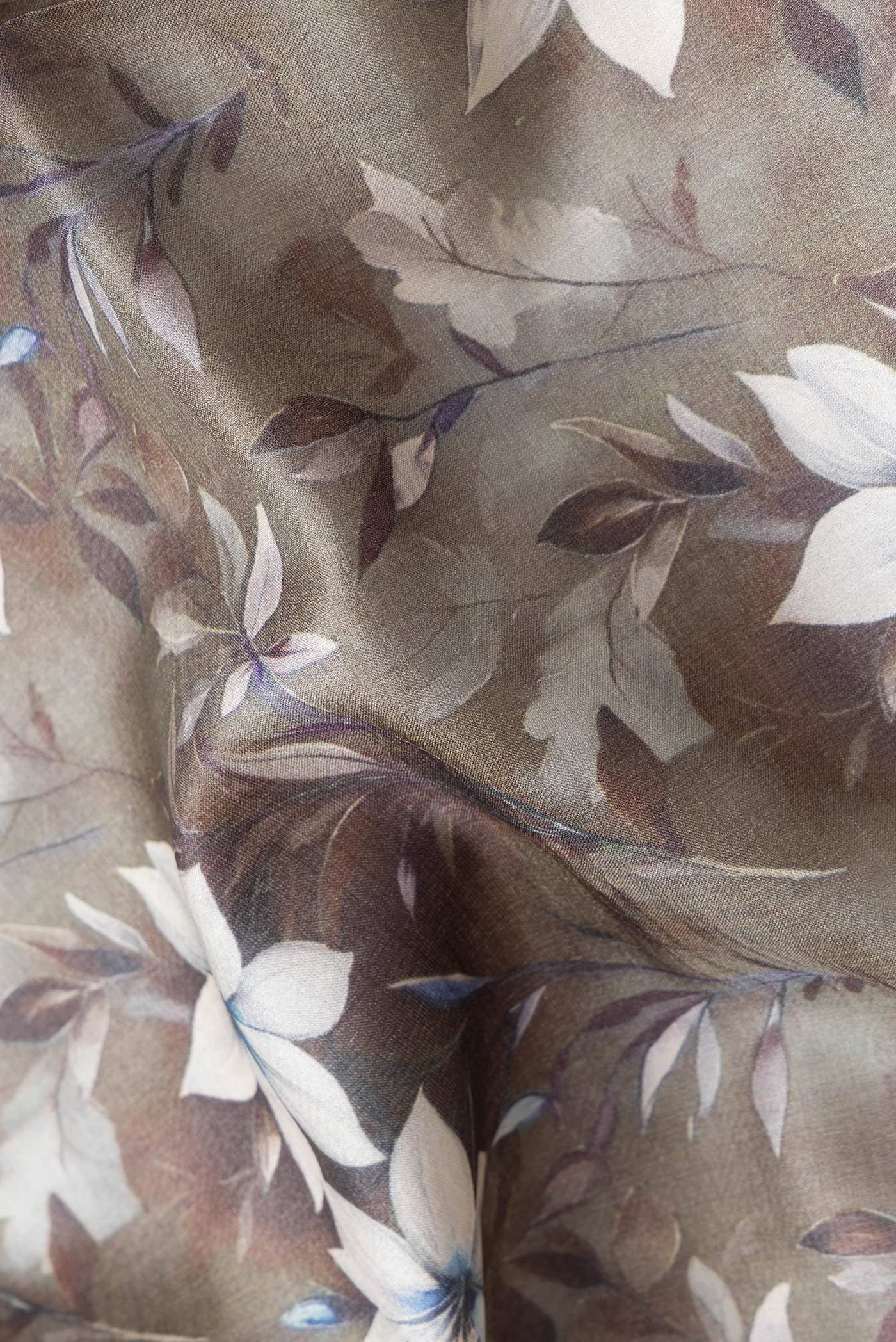 Close up of Mehandi Green Dual Tone Tussar Silk Saree with Printed design on the body and Zari Border.  displaying folds