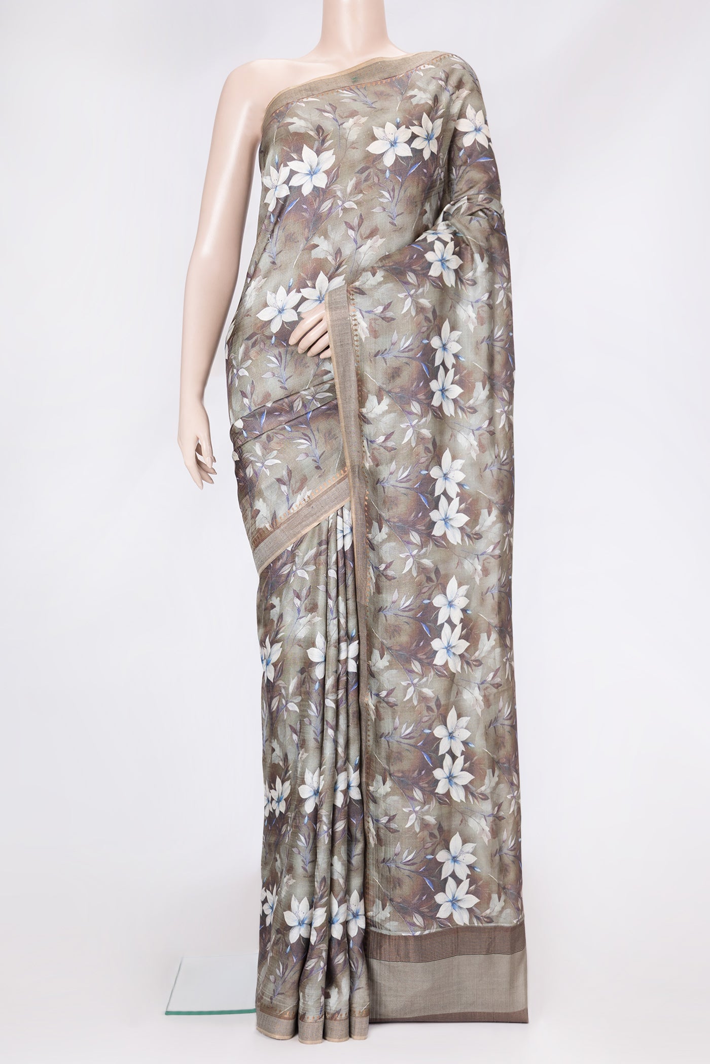 Mehandi Green Dual Tone Tussar Silk Saree with Printed design on the body and Zari Border.  displayed on a mannequin