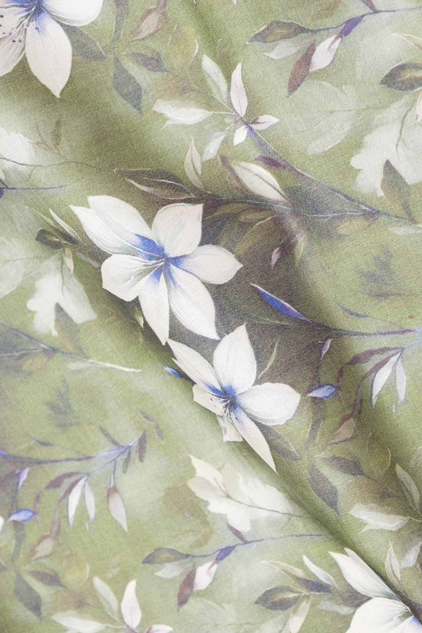 Close up of Green Dual Tone Tussar Silk Saree with Printed design on the body and Zari Border displaying folds