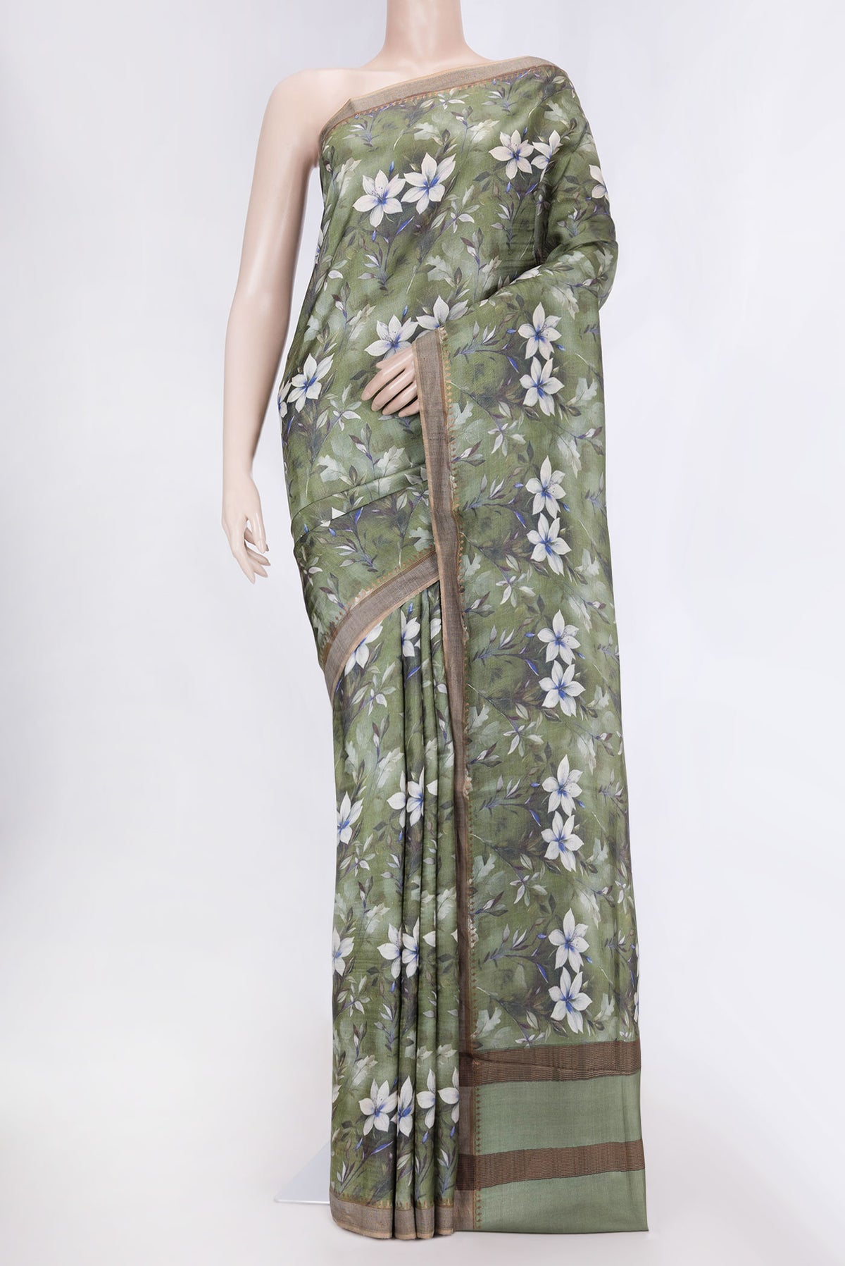 Green Dual Tone Tussar Silk Saree with Printed design on the body and Zari Border displayed on a mannequin