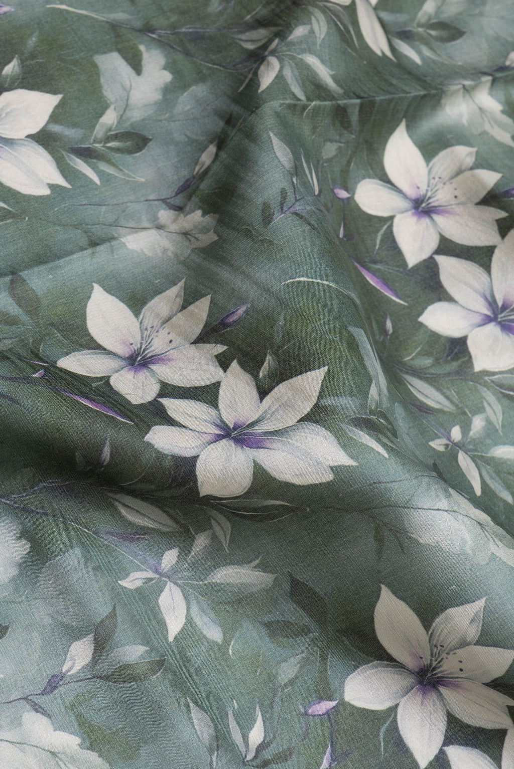 Close up of Green Dual Tone Organza Silk Saree with Printed design on the body and Zari Border.  displaying folds