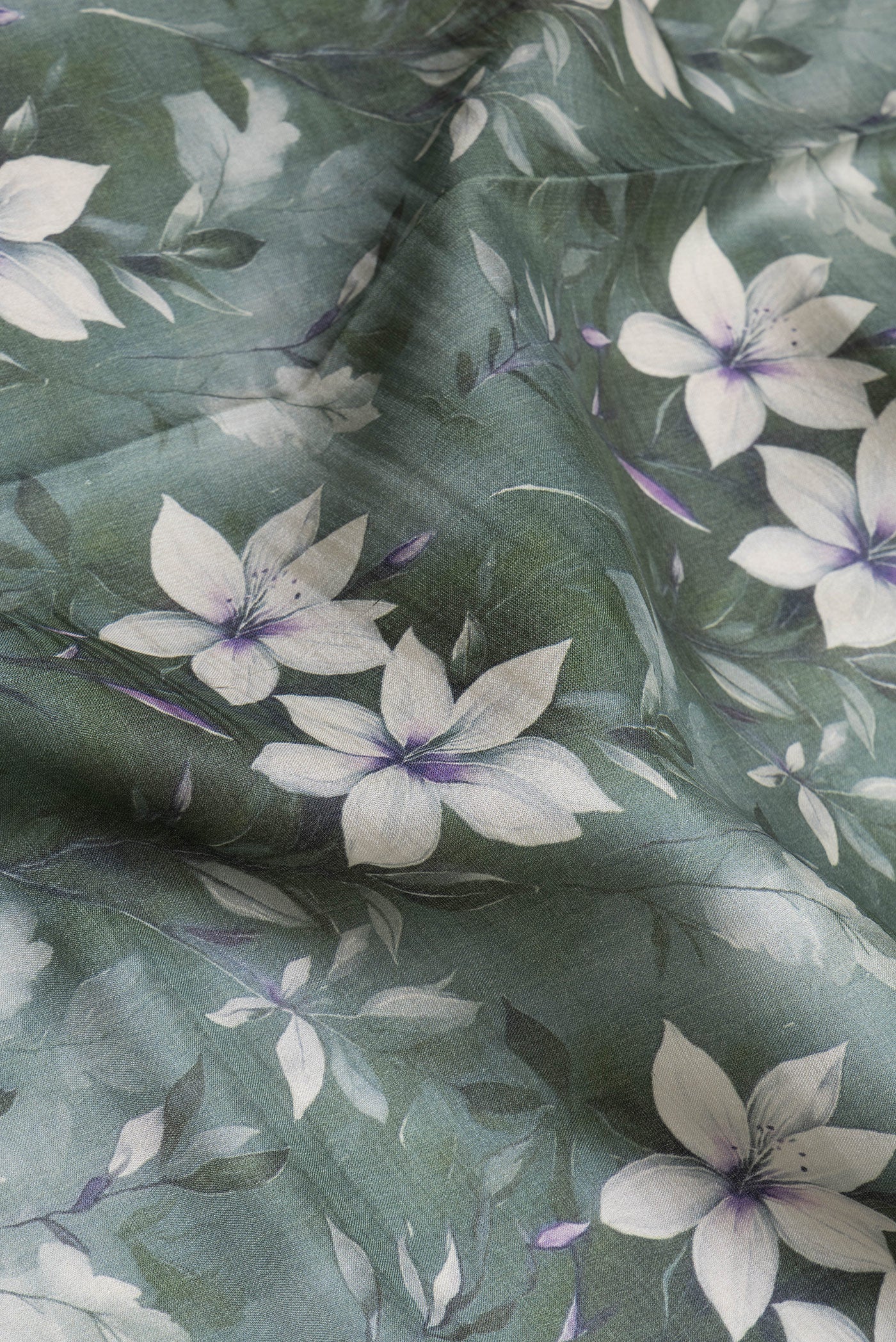 Close up of Green Dual Tone Organza Silk Saree with Printed design on the body and Zari Border.  displaying folds