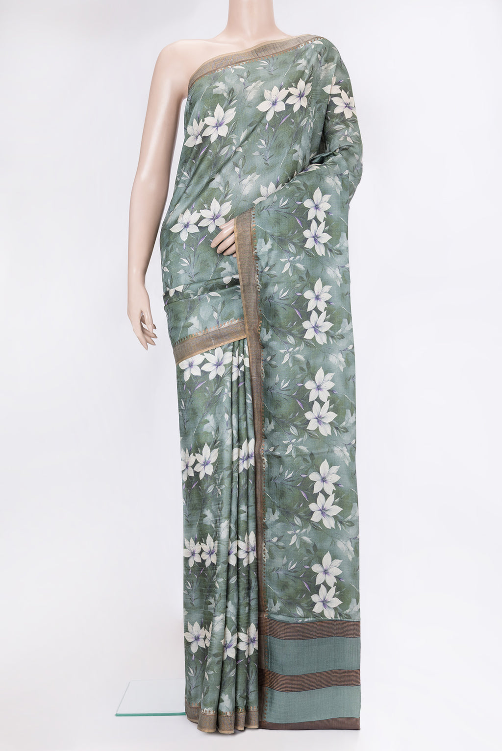 Green Dual Tone Organza Silk Saree with Printed design on the body and Zari Border.  displayed on a mannequin