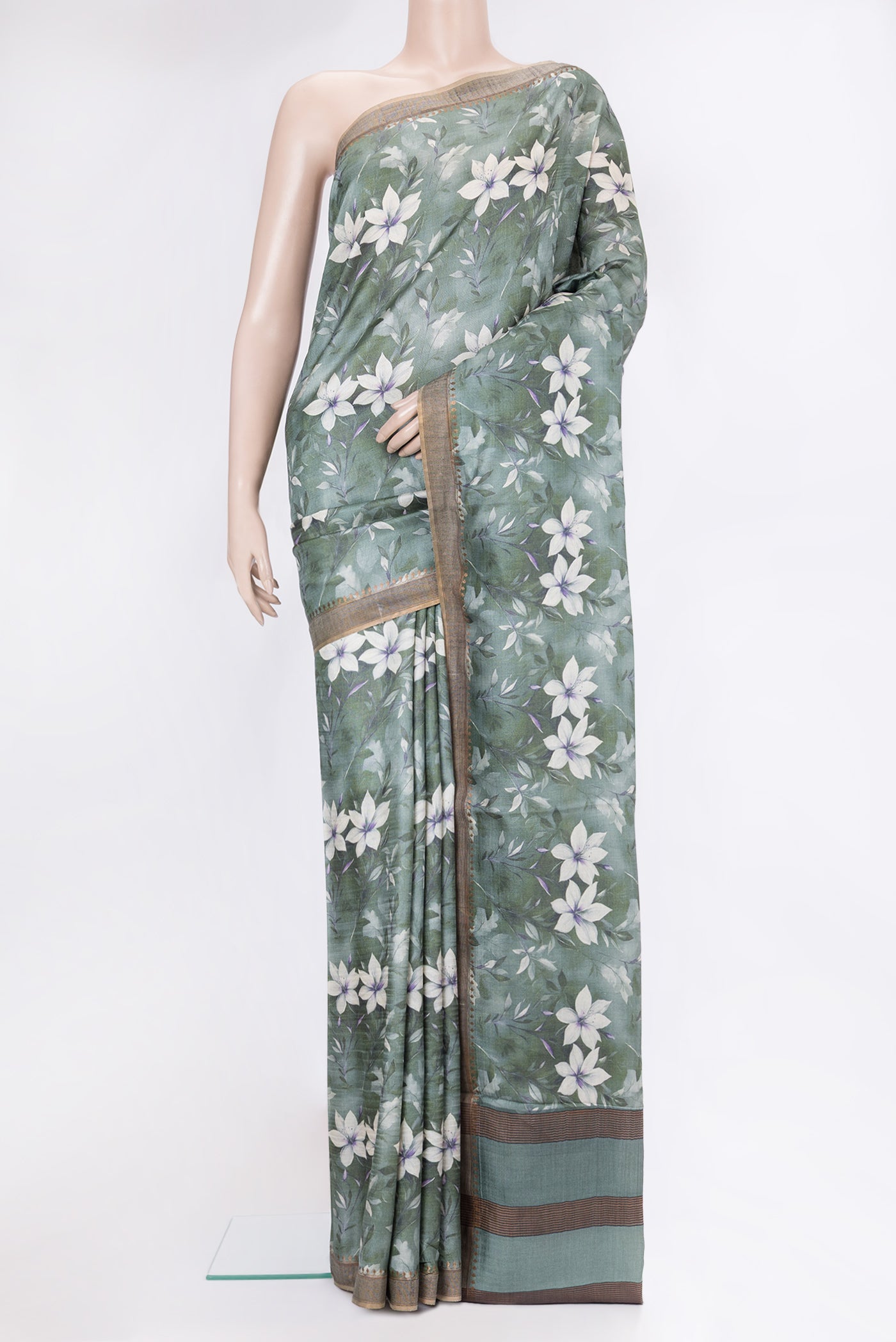 Green Dual Tone Organza Silk Saree with Printed design on the body and Zari Border.  displayed on a mannequin
