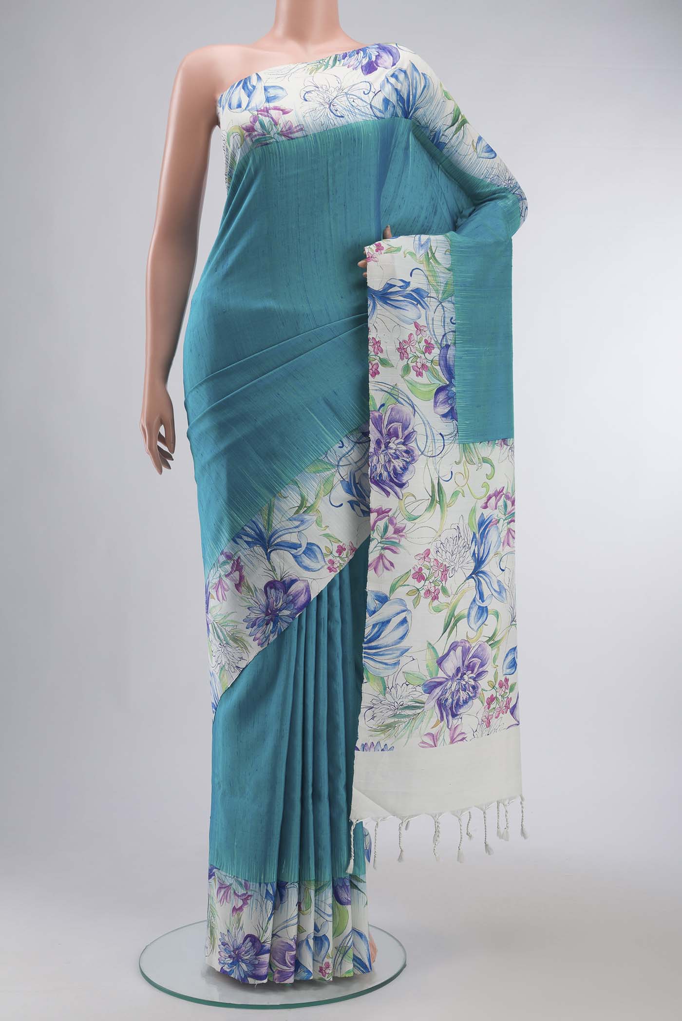 Blue Soft Silk Saree with Plain Body and Printed Border displayed on a mannequin