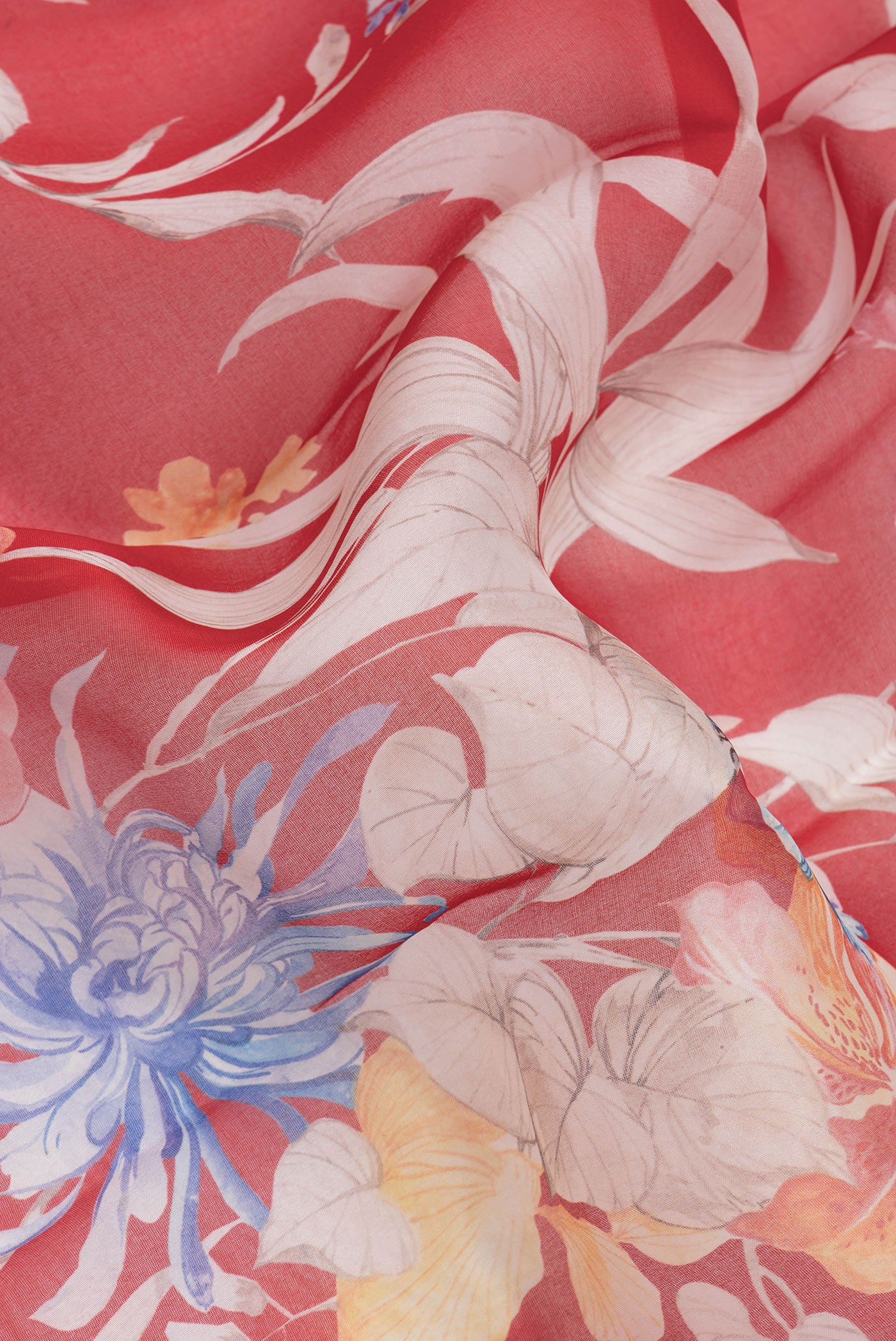 Close up of Red Dual Tone Organza Silk Saree with Printed design on the body and Zari Border.  displaying folds