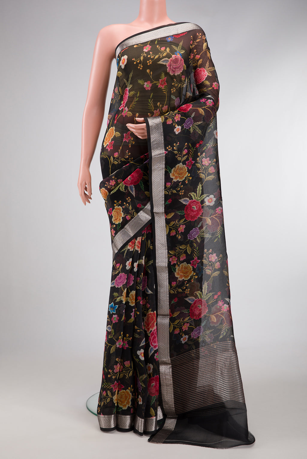 Black Dual Tone Organza Silk Saree with Printed design on the body and Zari Border.  displayed on a mannequin