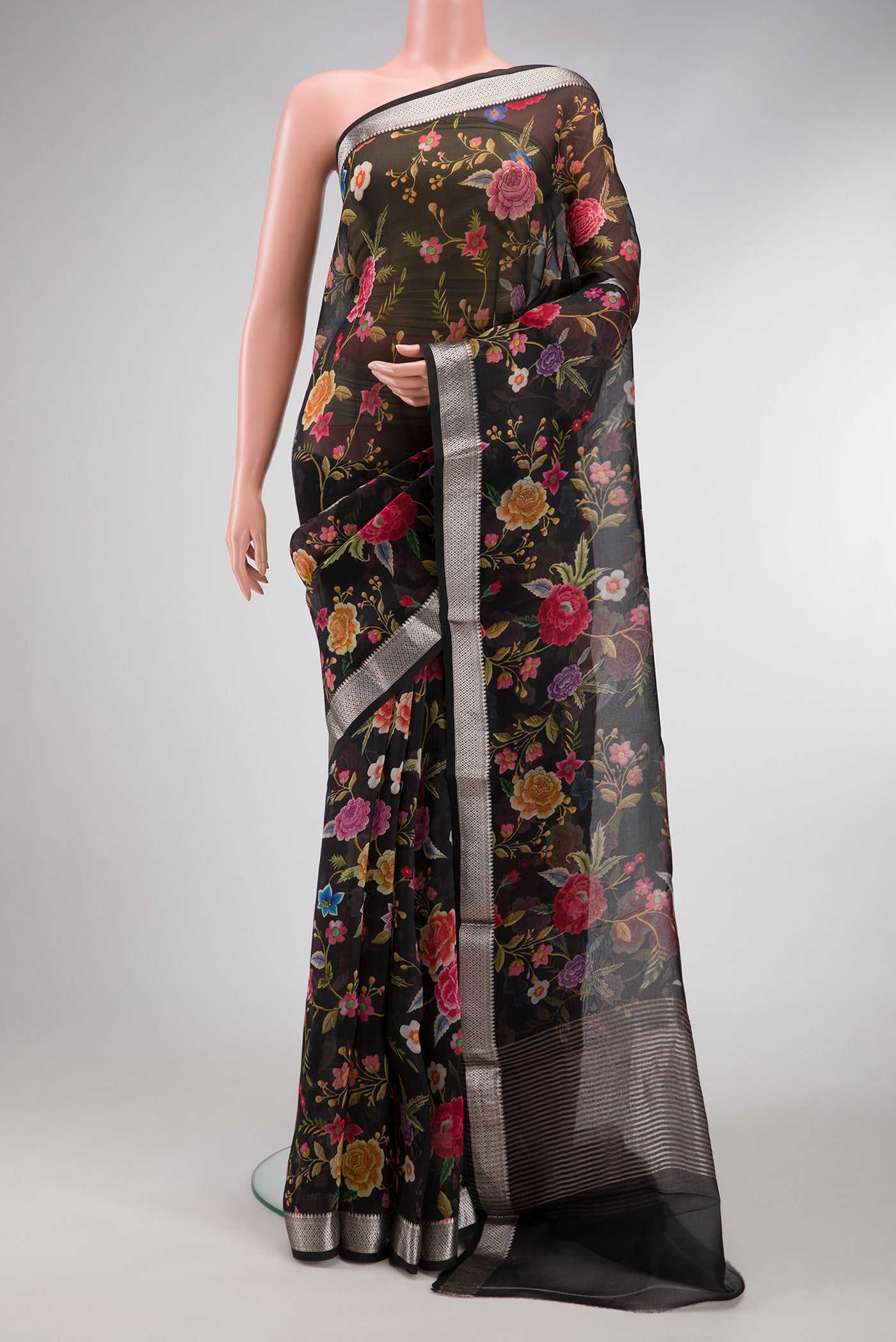 Black Dual Tone Organza Silk Saree with Printed design on the body and Zari Border.  displayed on a mannequin