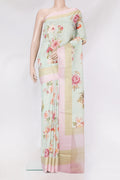 Sea Green Tussar Silk Saree with Floral Print on the body and Printed Border.  displayed on a mannequin