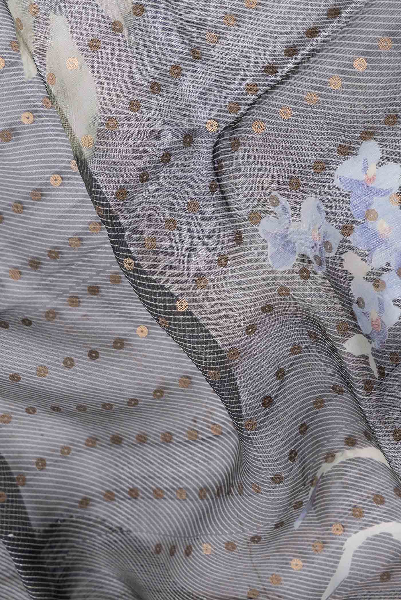 Close up of Black Dual Tone Tussar Silk SareePrinted design on the body and Plain Border displaying folds