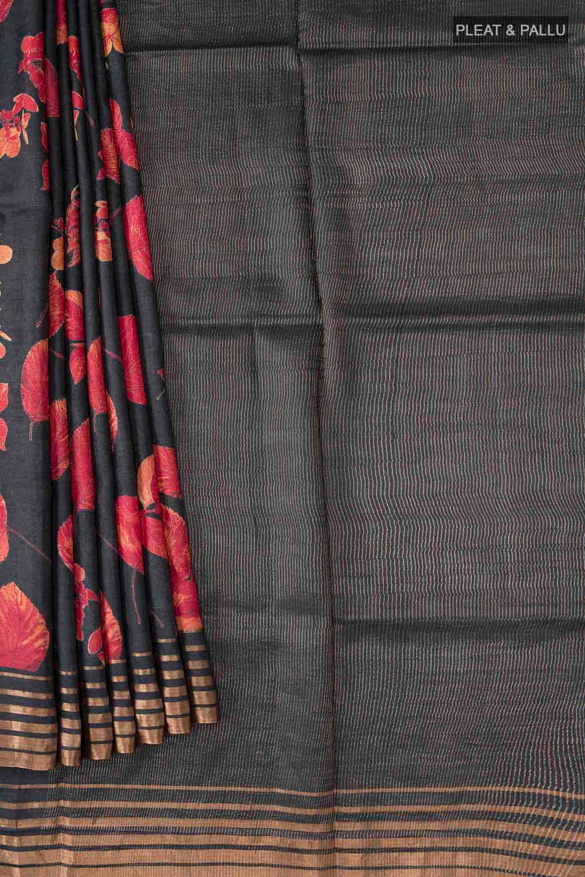 Pleats and pallu of Black Bhagalpuri Tussar Silk Saree with Floral Print on the body and Zari Border