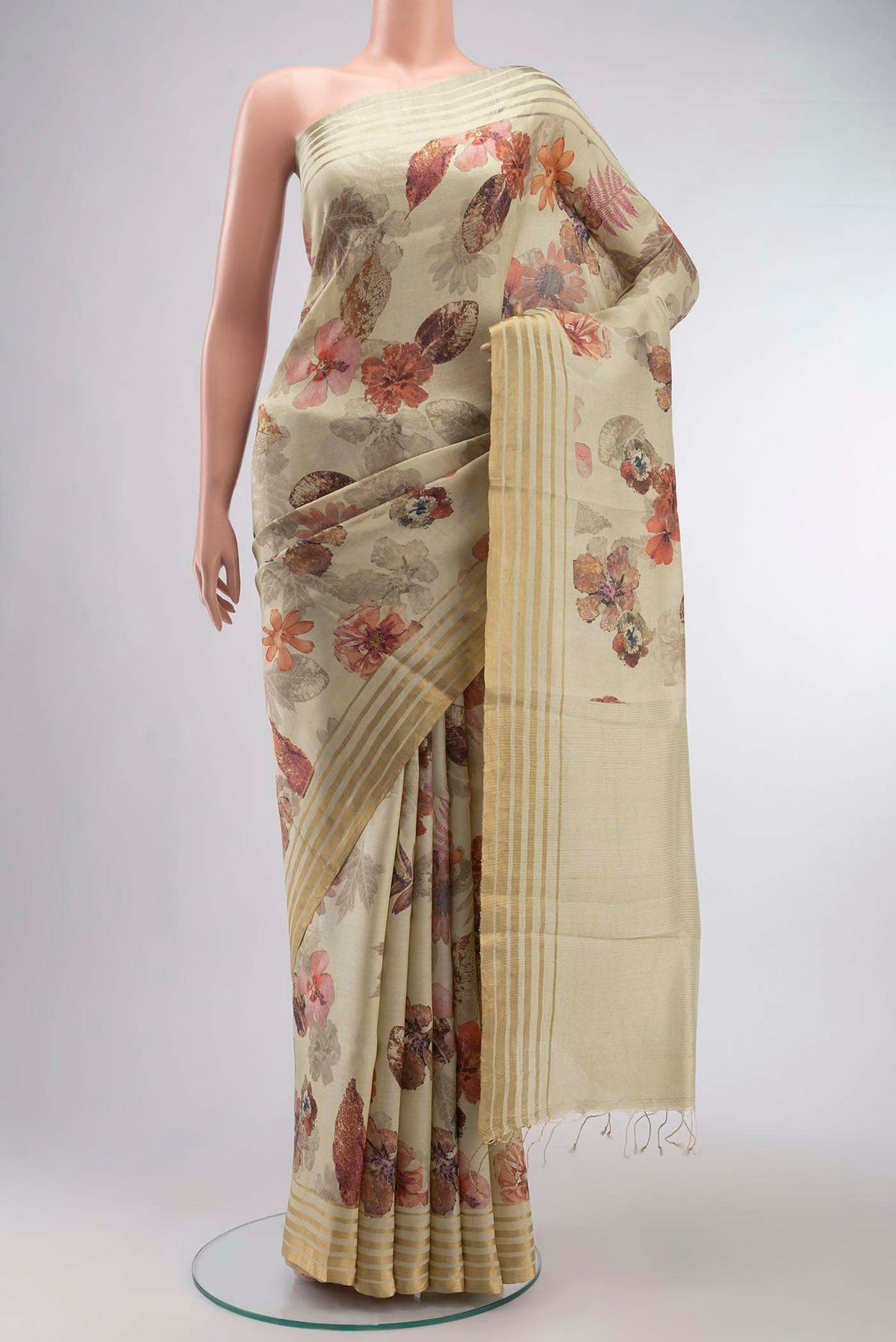 Beige Bhagalpuri Tussar Silk Saree with Floral Print on the body and Zari Border displayed on a mannequin