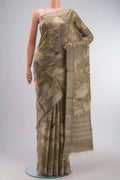 Beige Tussar Silk Saree with Printed design on the body and Zari Border displayed on a mannequin