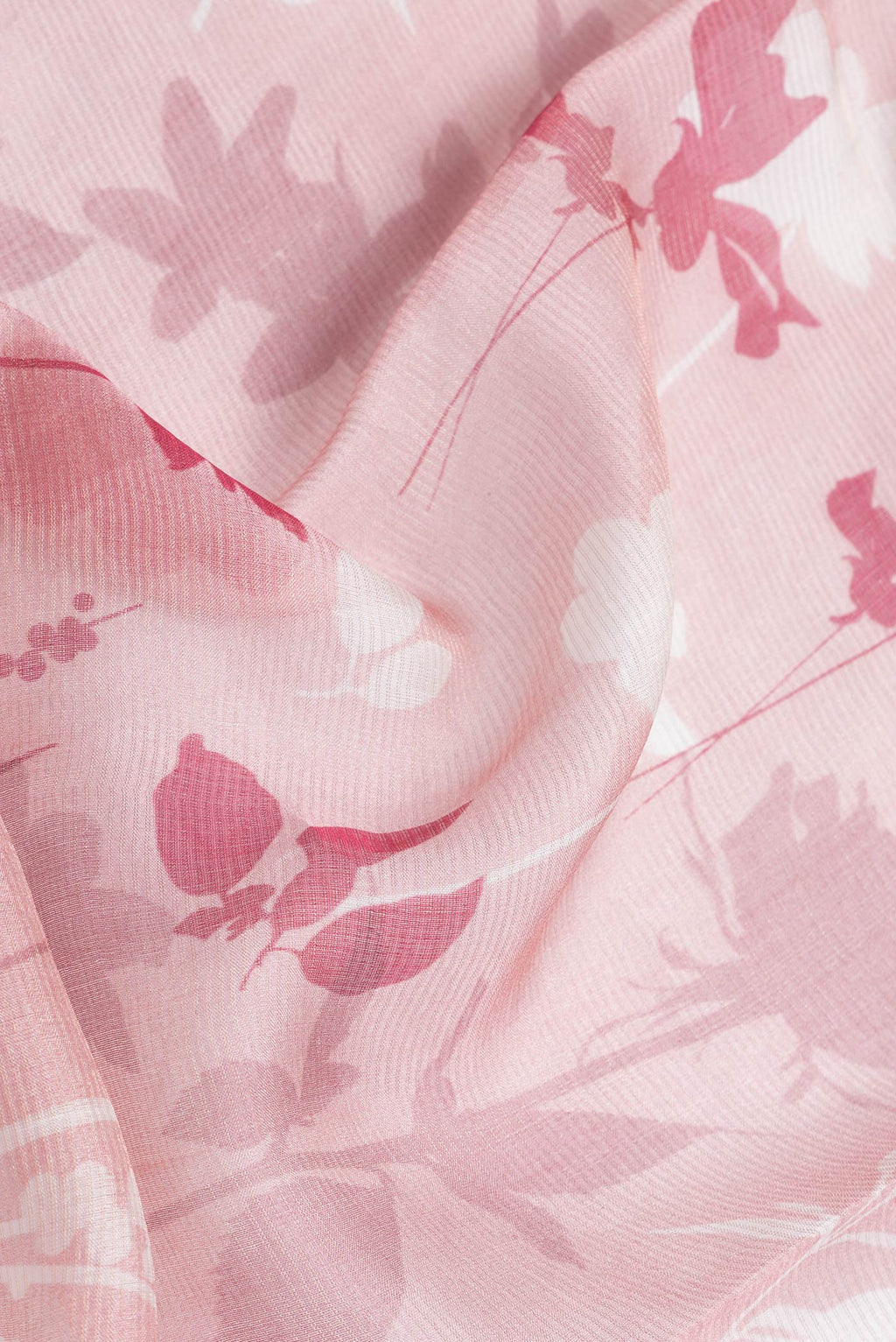 Close up of Pink Dual Tone Tussar Silk Saree with Printed design on the body and Embroidery Border.  displaying folds