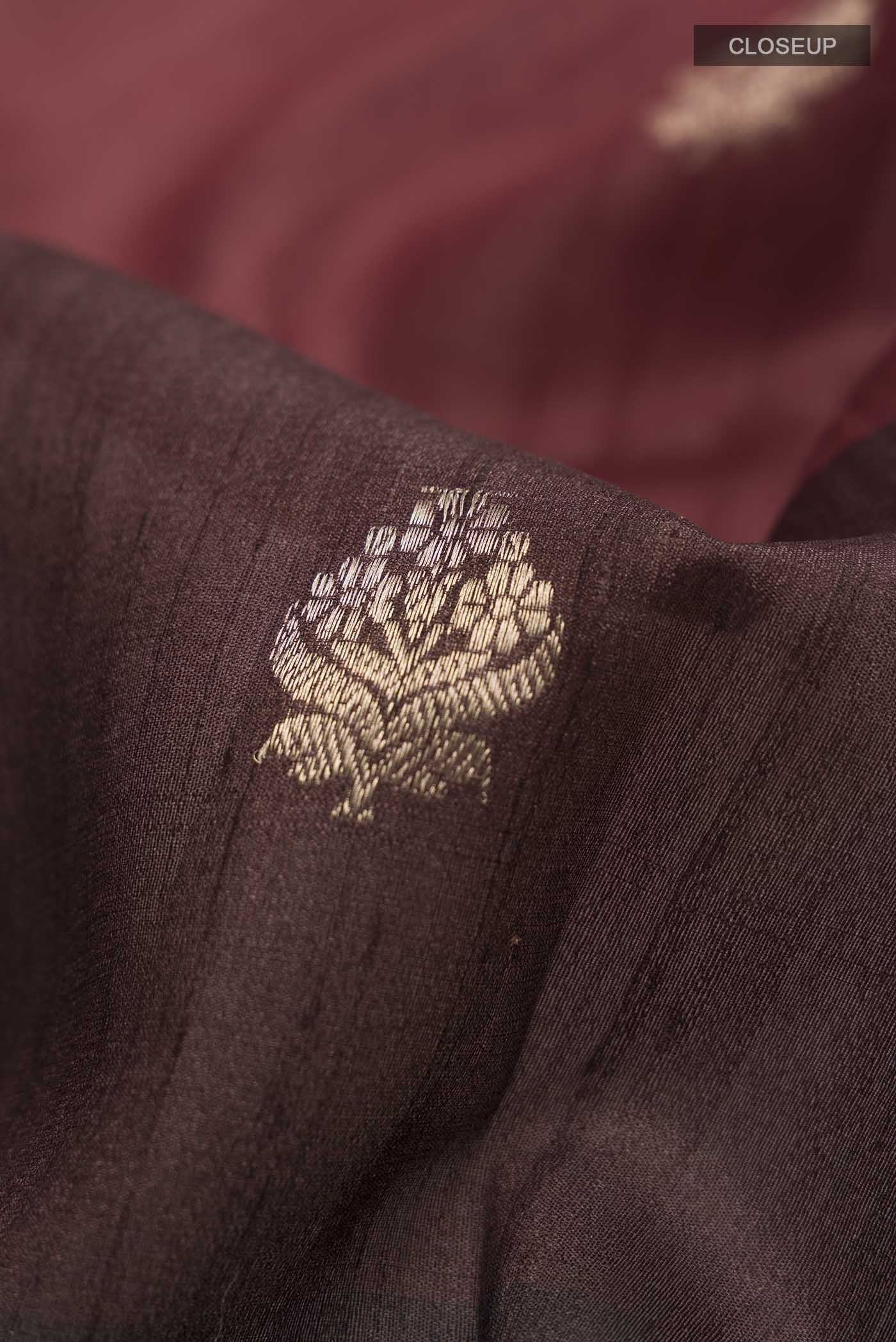 Close up of Multi Color Banarasi Tussar Silk Saree with Zari Butta on the body and Zari Border displaying folds