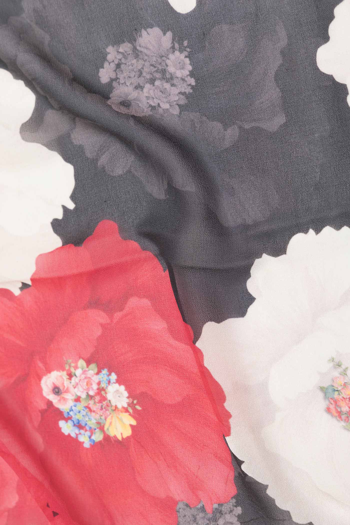 Close up of Black Dual Tone Mysore Georgette Saree with Printed design on the body and Plain Border displaying folds