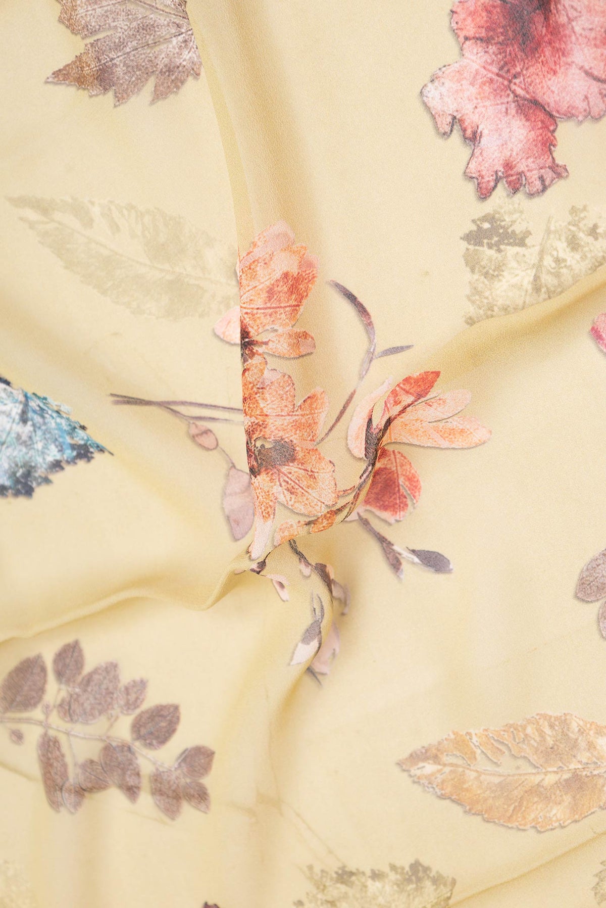 Close up of Caramel Mysore Georgette Saree With Printed design on the body and Without Border displaying folds